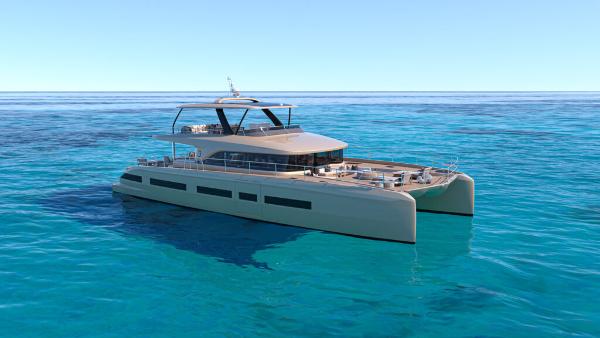 Luxurious 2025 Lagoon 83 yacht cruising on clear blue ocean waters.