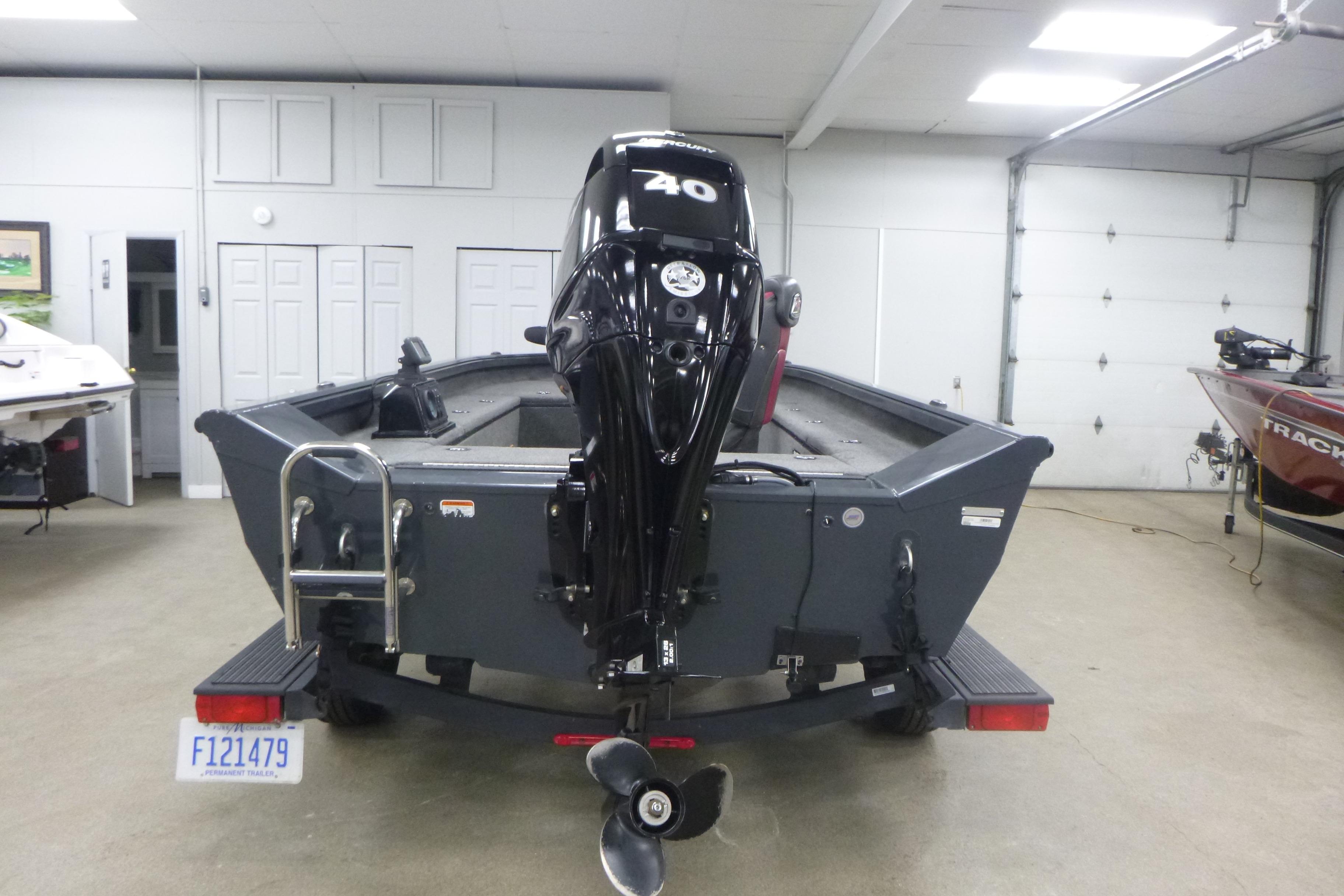 2021 Ranger VS1660 T boat with 40 HP motor in a garage setting.