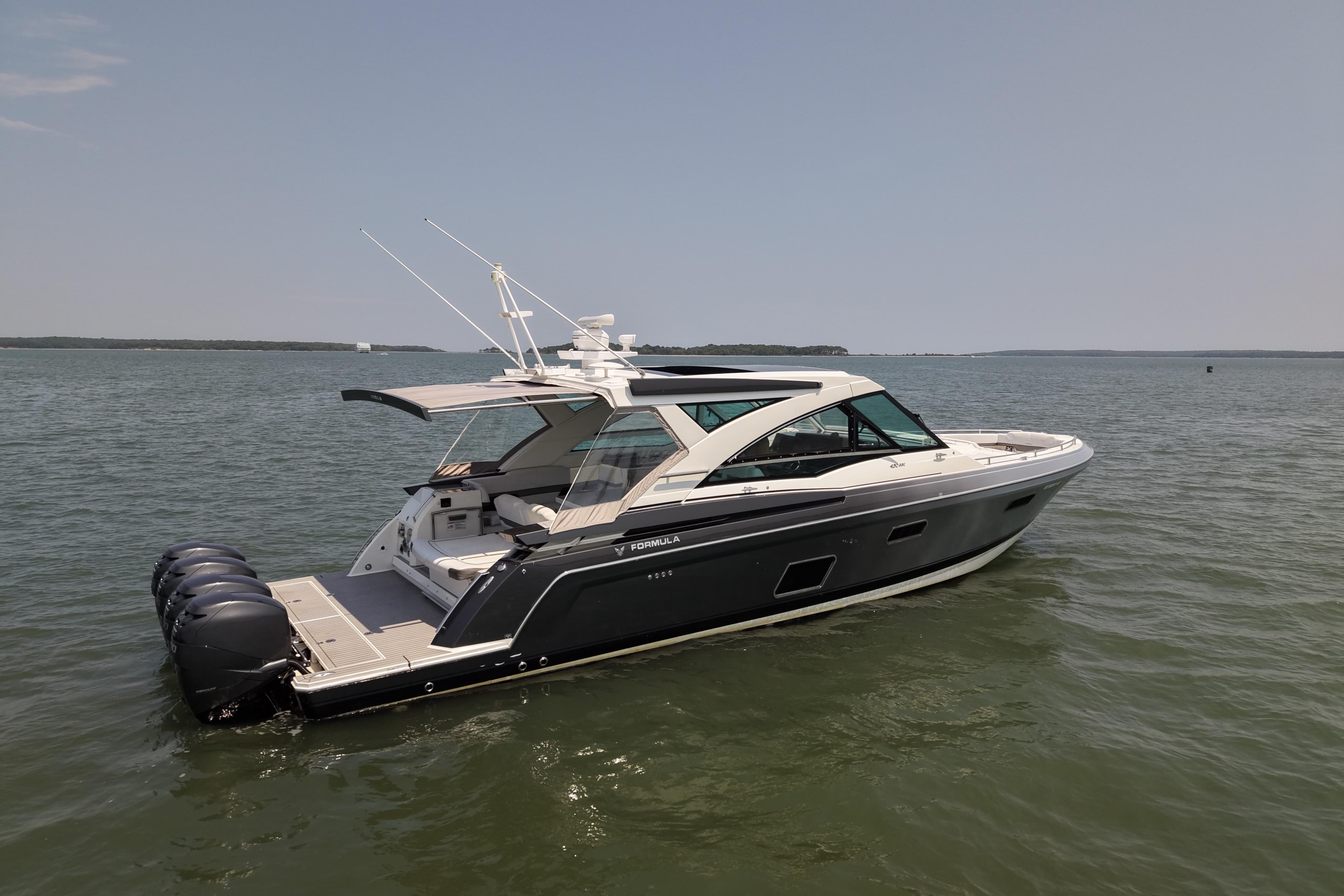 2019 Formula 430 Super Sport Crossover boat on calm water, showcasing sleek design and powerful engines.