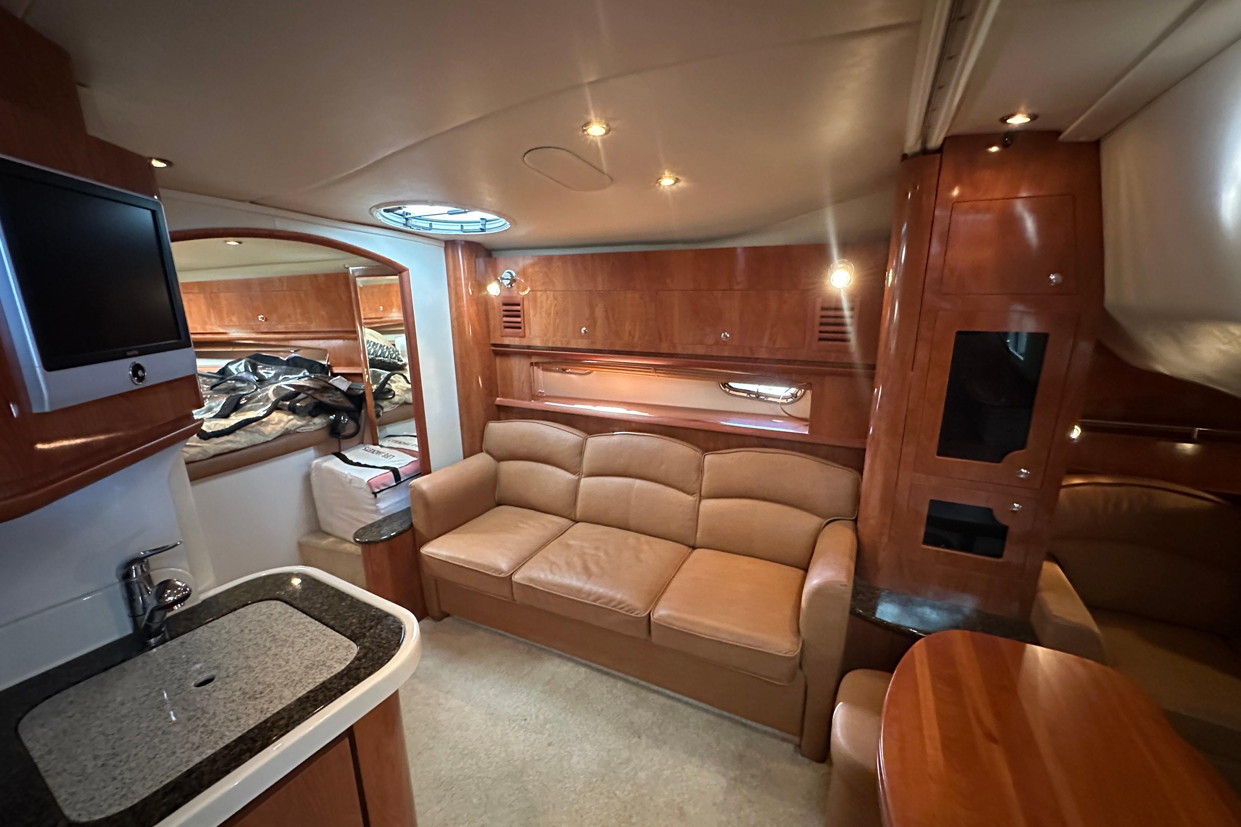 Luxurious interior of 2006 Four Winns 378 Vista yacht with leather seating and modern amenities.