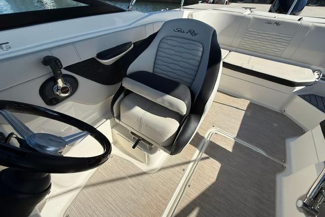2022 Sea Ray SPX 210 Outboard interior with steering wheel and seating.