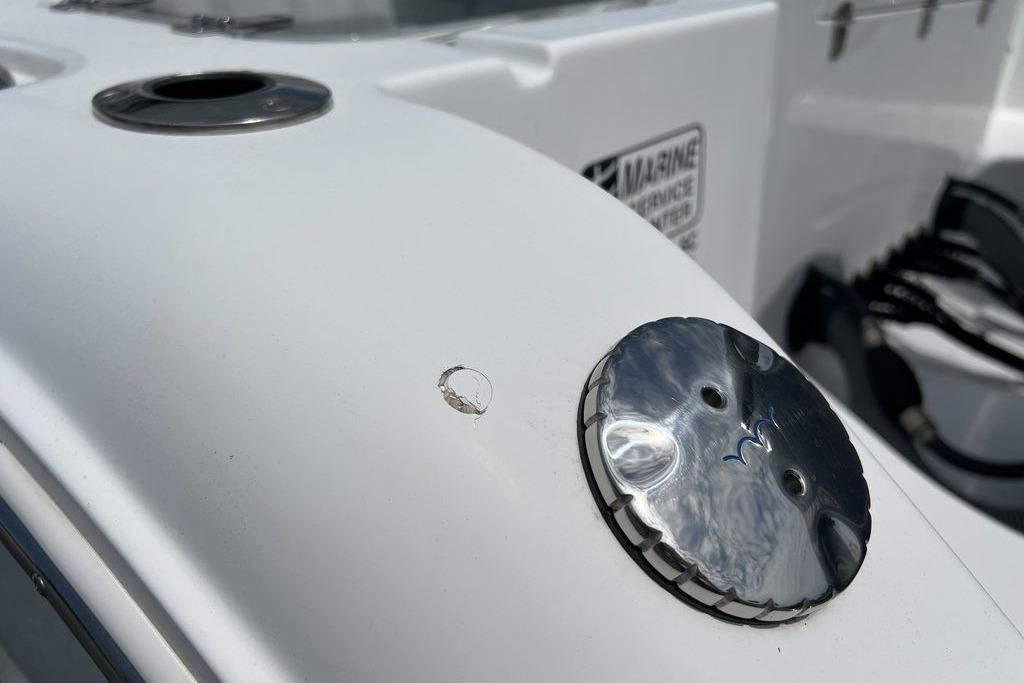 2021 Sea Hunt Gamefish 25 boat detail with metal fittings and surface blemish.