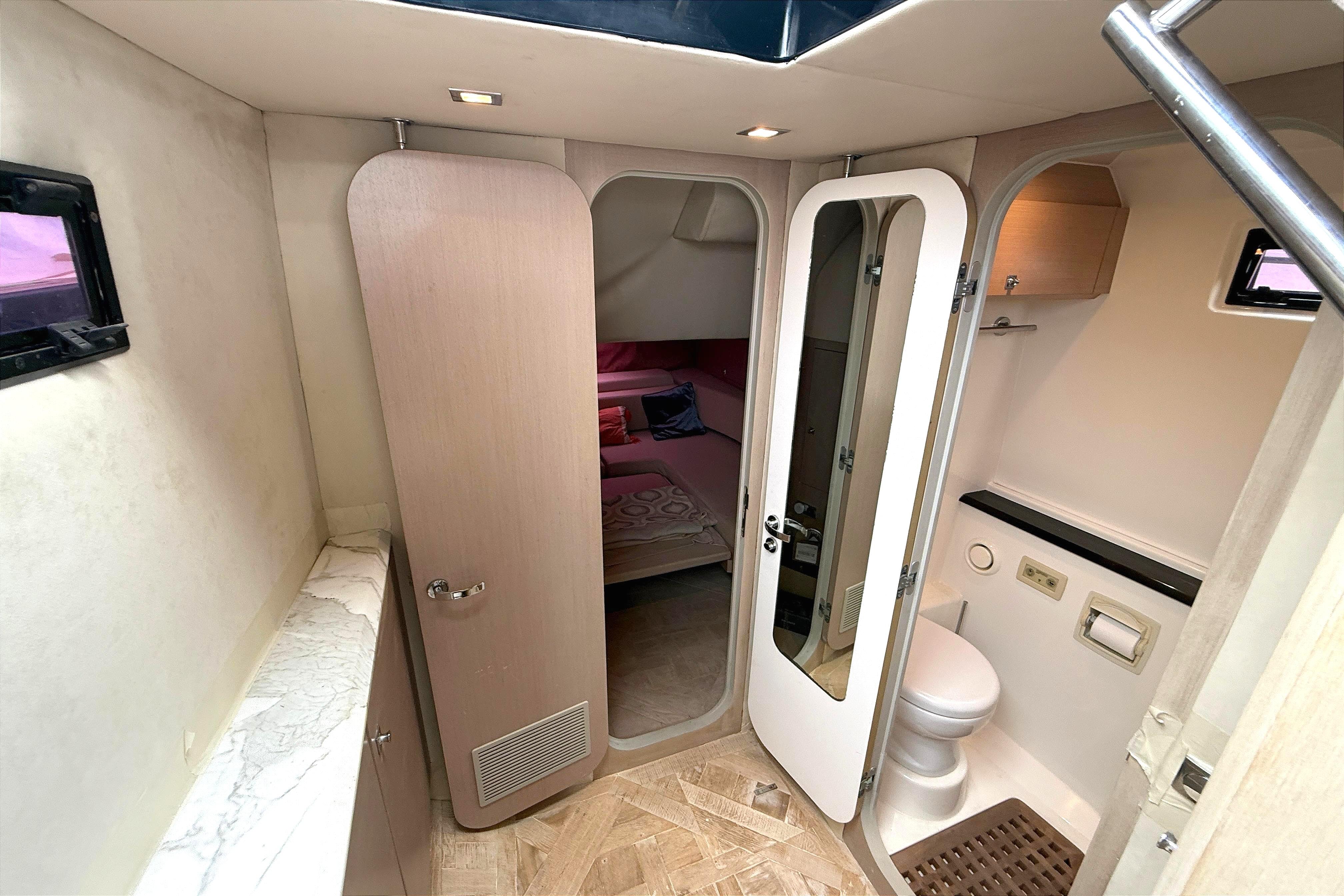 Interior of 2013 Windy SR52 yacht showing bathroom and bedroom.
