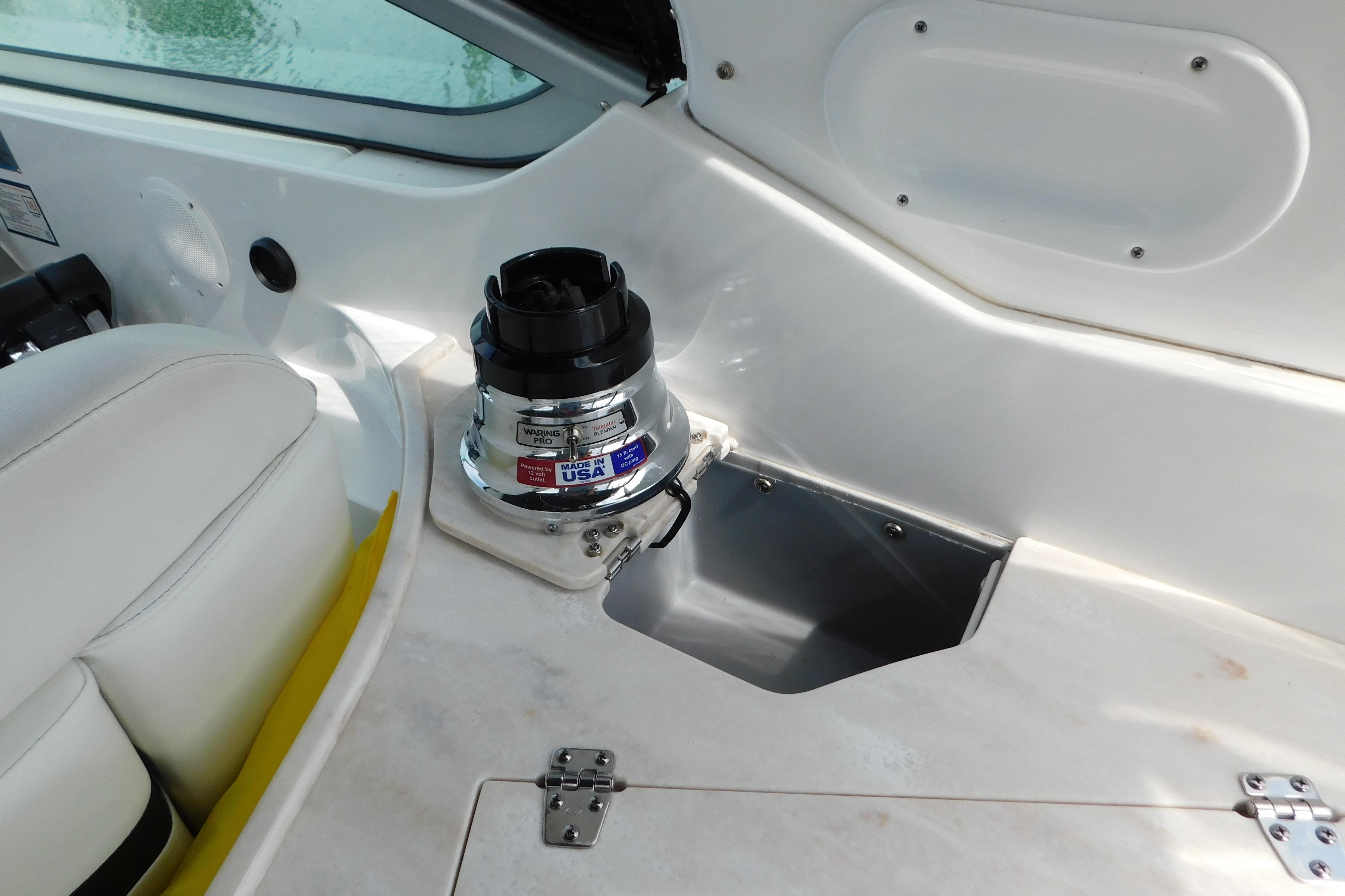 2017 Rinker EX 320 boat interior with built-in blender and seating area.