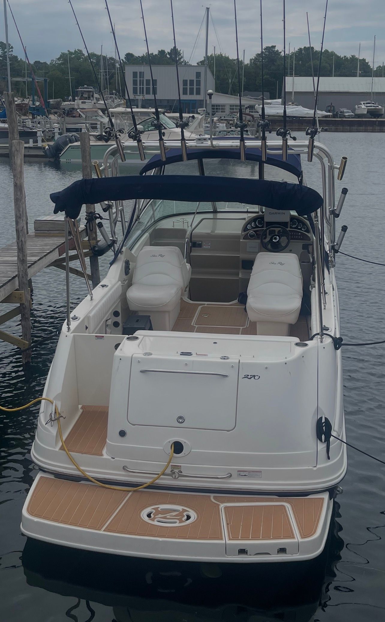 2006 Sea Ray 270 Amberjack boat docked at marina.