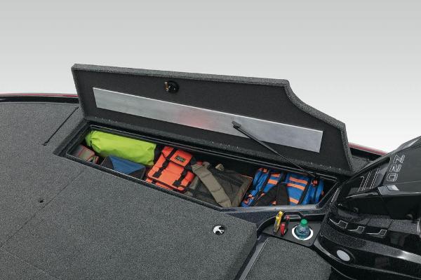 Open storage compartment on 2022 Nitro Z20 boat with life jackets and gear.