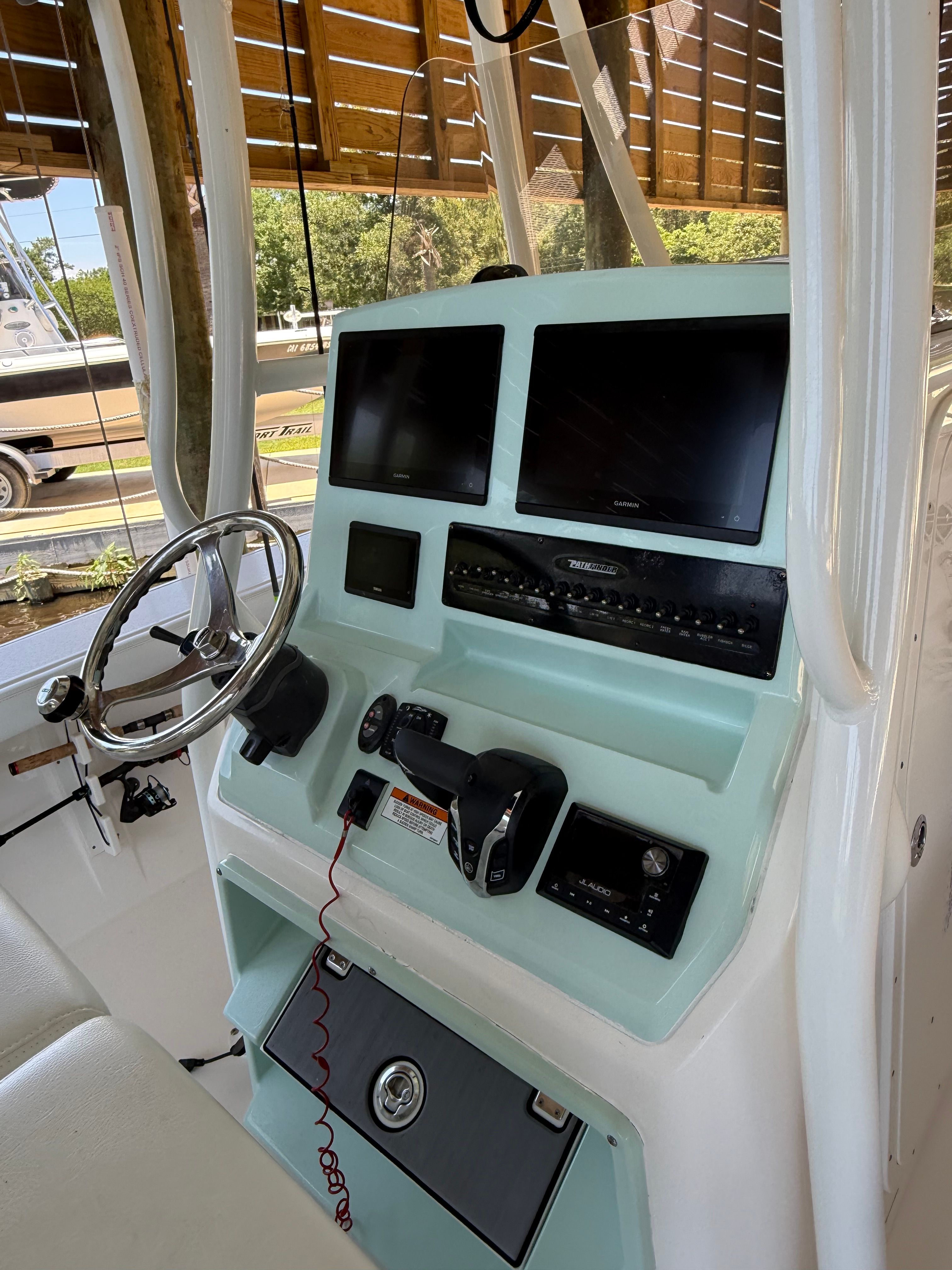 Pathfinder 2700 Open 2024 helm with modern navigation instruments.
