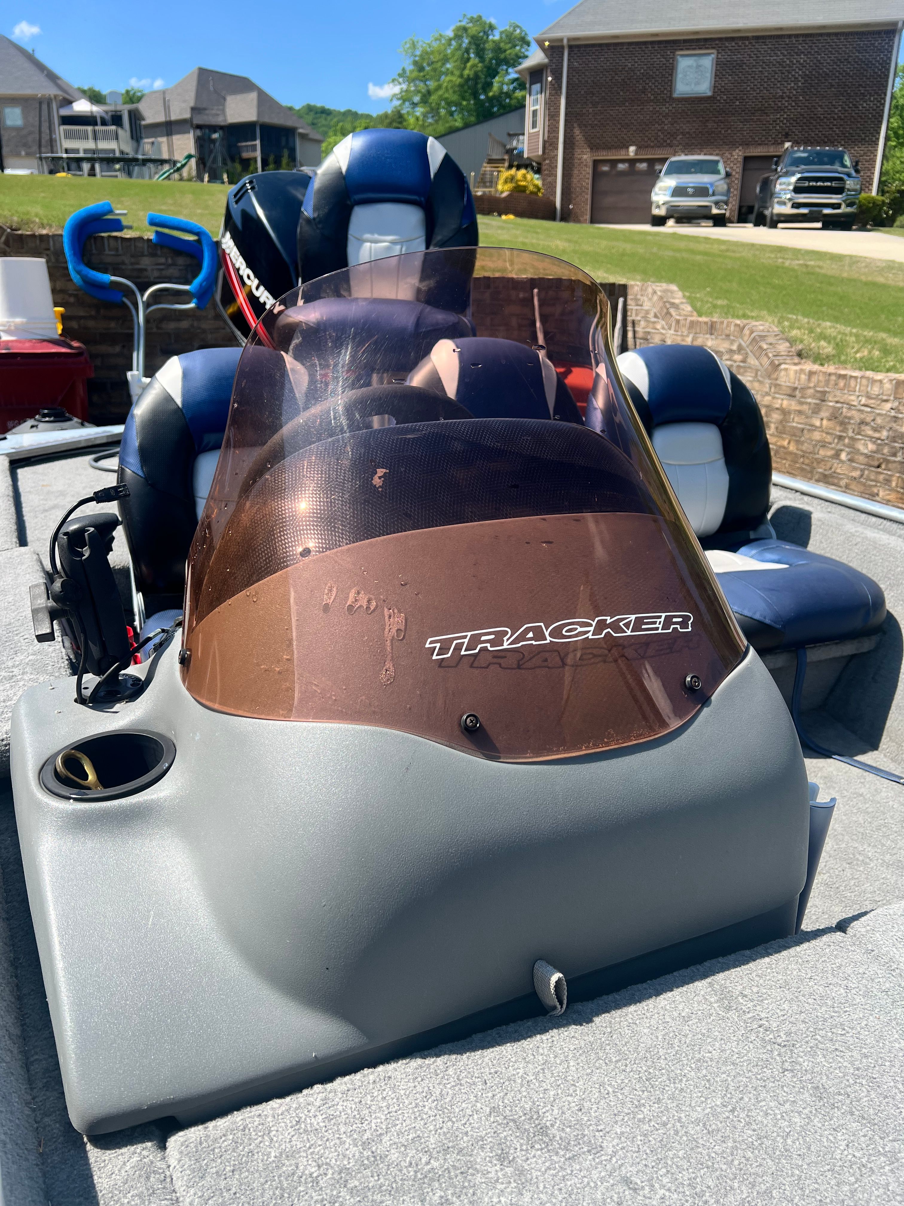 2007 Bass Tracker Pro 170 boat with windshield parked outdoors.