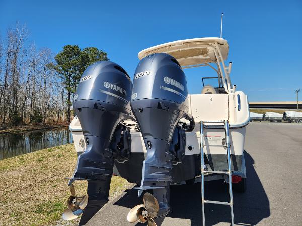 2015 Grady-White Freedom 275 boat with twin Yamaha 350 engines, parked near water.