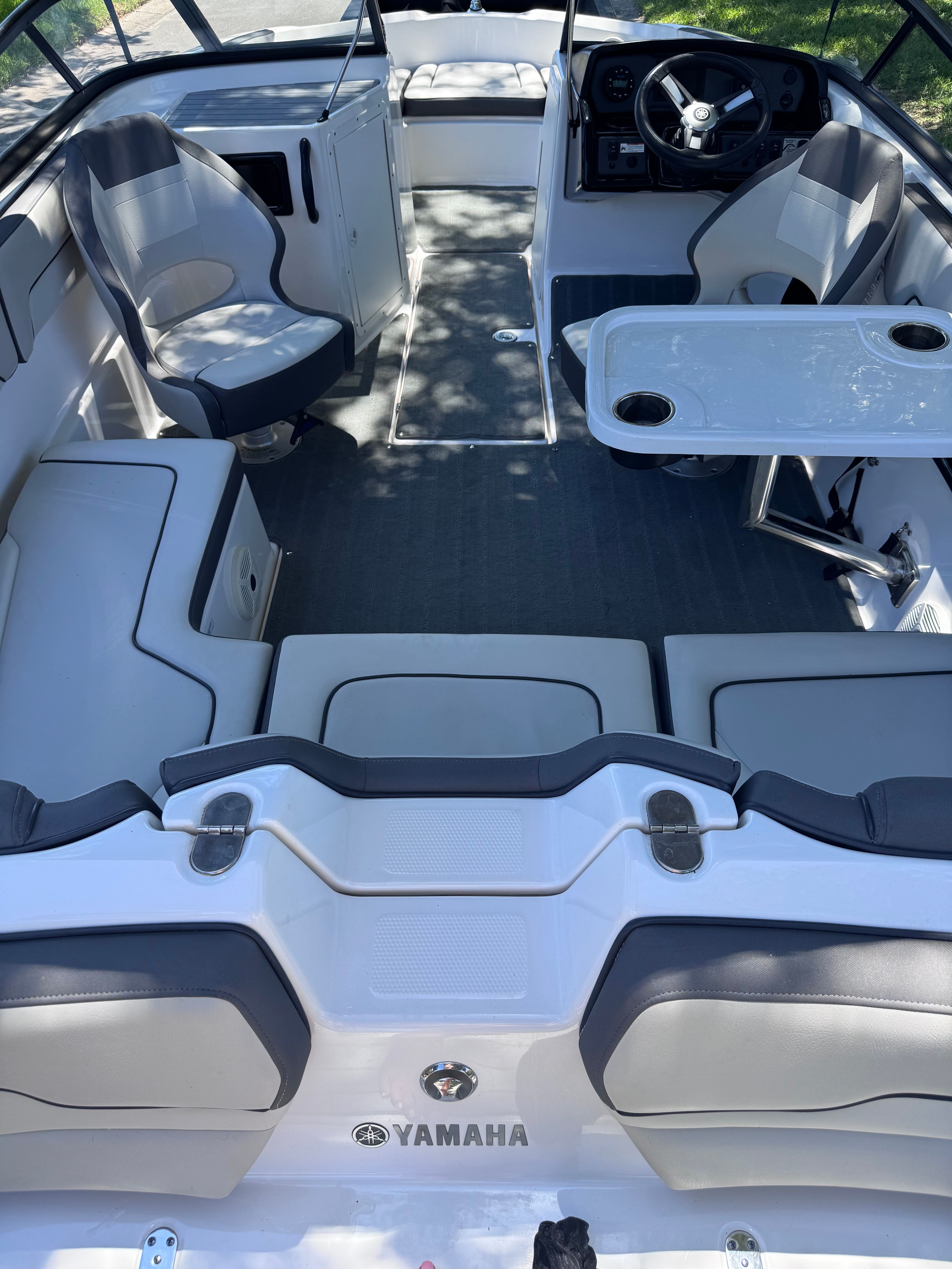 Interior of a 2020 Yamaha SX190 boat with seating and table.