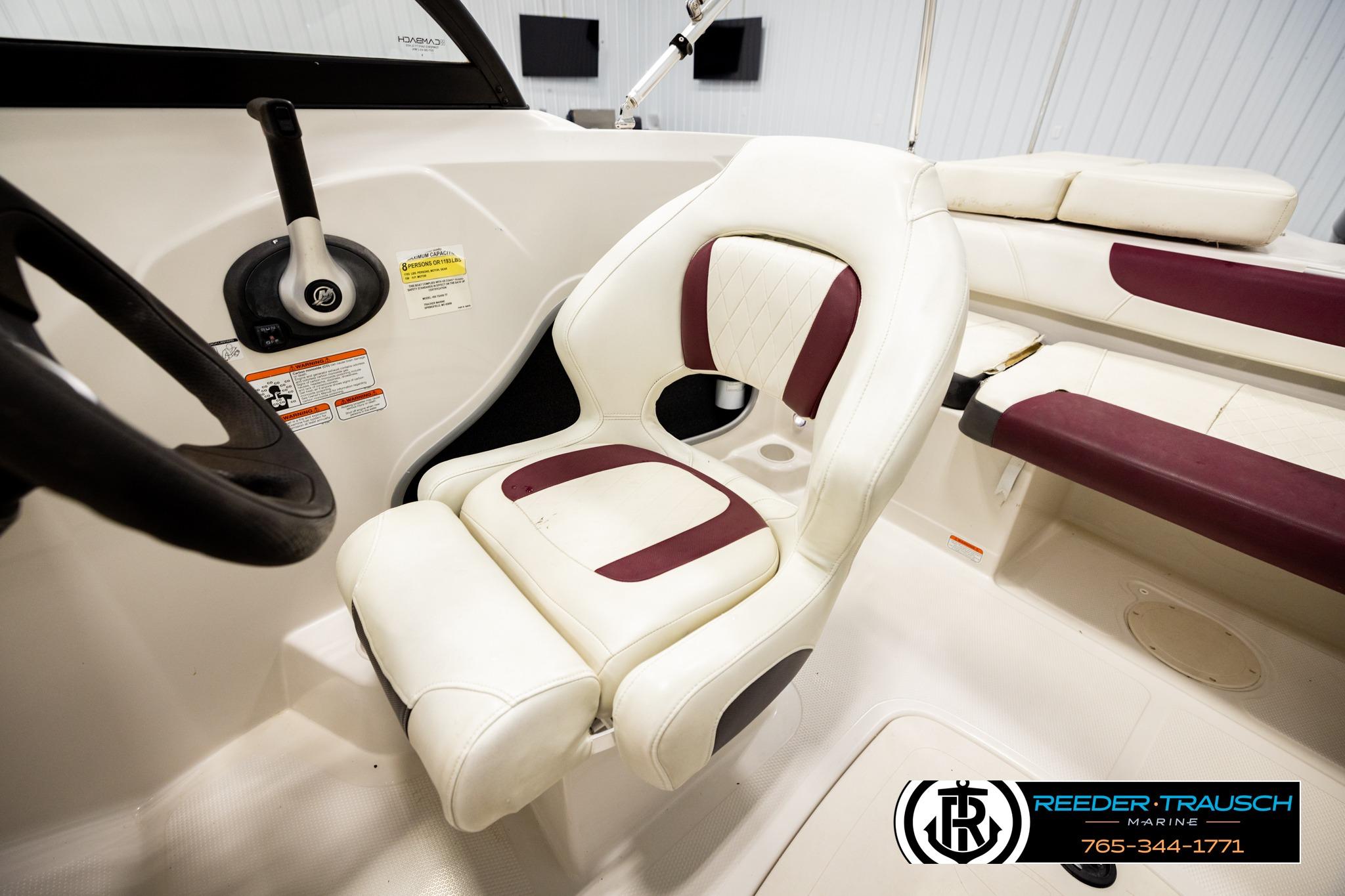 Interior of a 2016 Tahoe 450 TS boat with white and maroon seating.