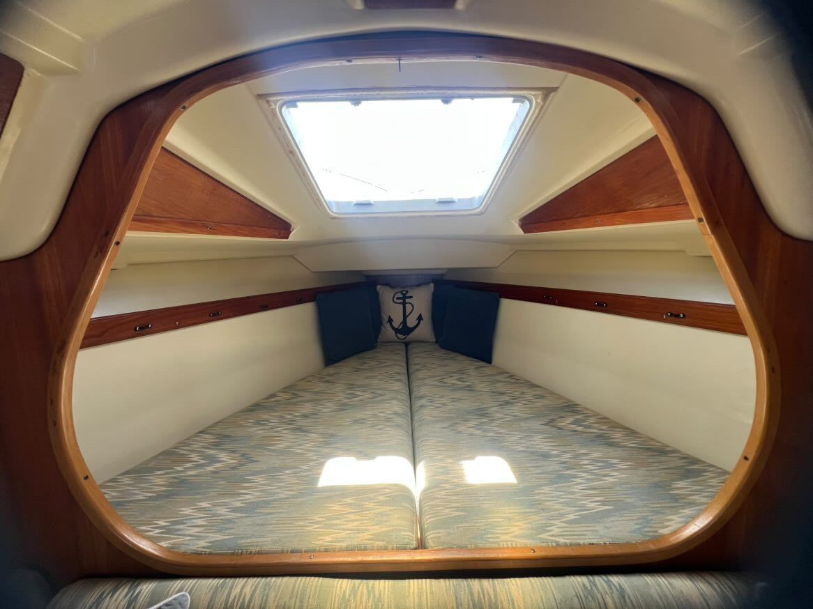 Interior of a 1988 Pearson 28 sailboat featuring a cozy sleeping cabin.