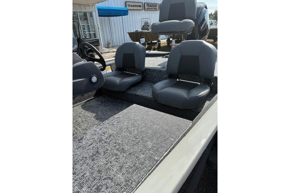2026 Tracker Pro 170 boat interior with gray seating and carpeted flooring.