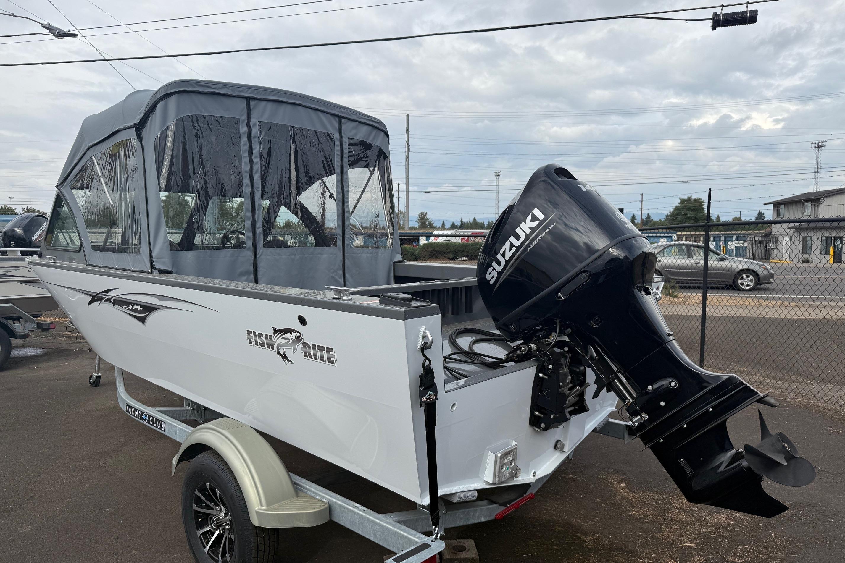 2026 Fish Rite Sportsman 20 boat with Suzuki outboard motor, parked on a trailer.
