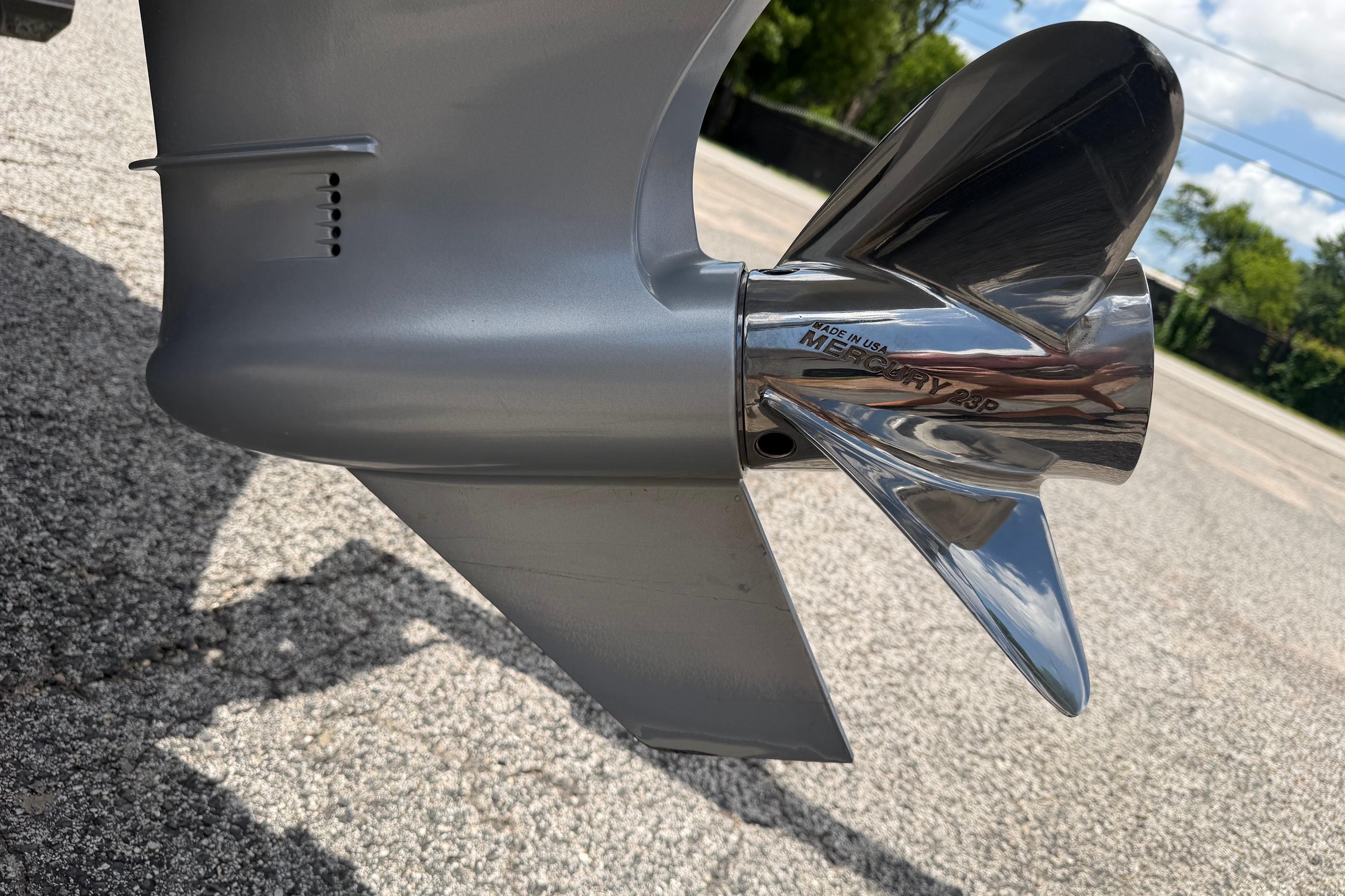 2020 Ranger Z520L boat propeller on pavement, showcasing shiny metallic finish.