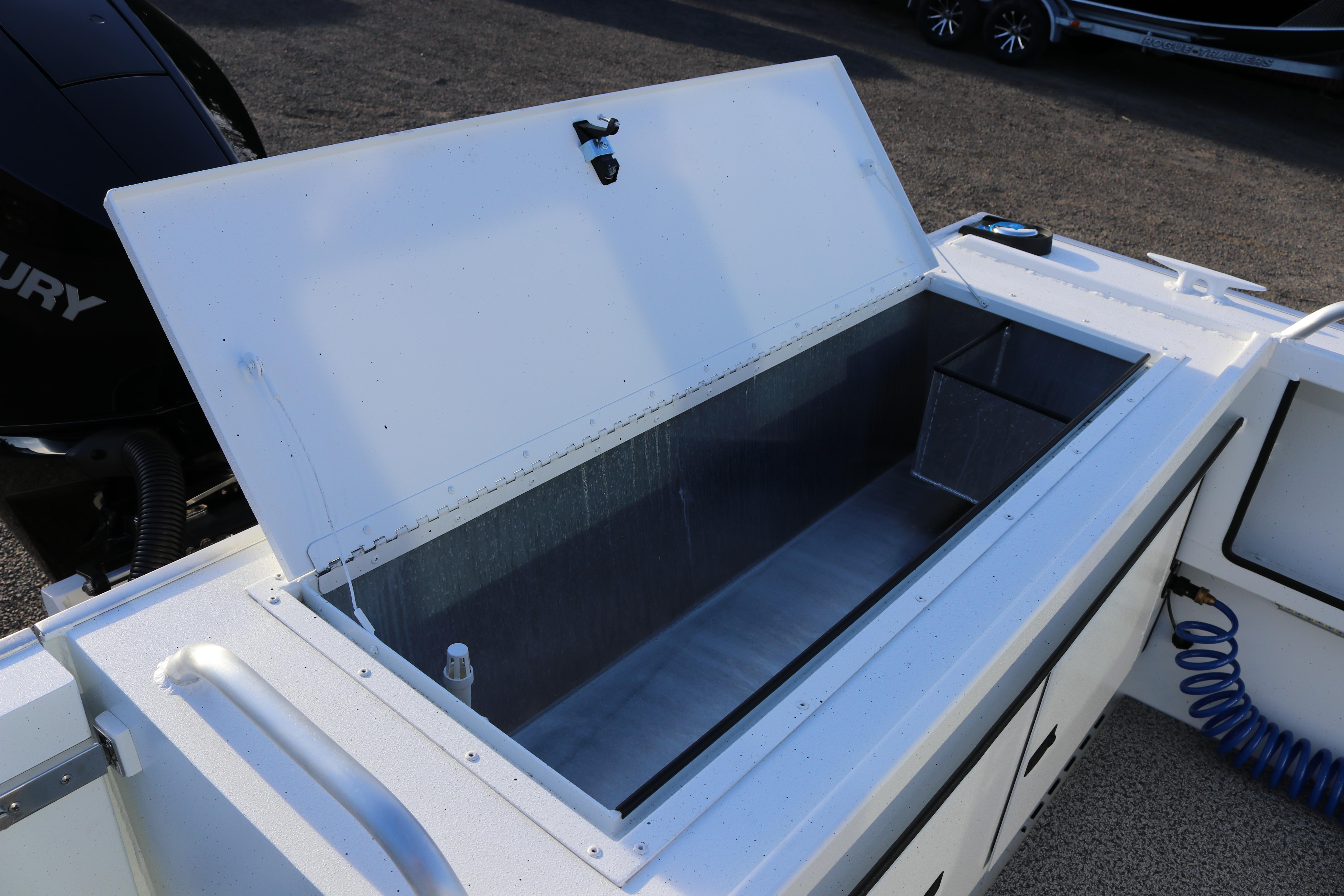 Open storage compartment on 2026 Alumaweld Intruder Outboard 22 boat.