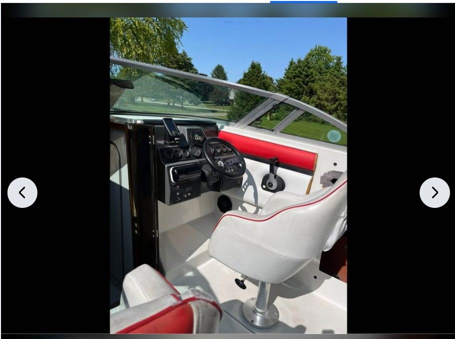 Interior of a 1990 Regal Valante 225C boat with steering console.