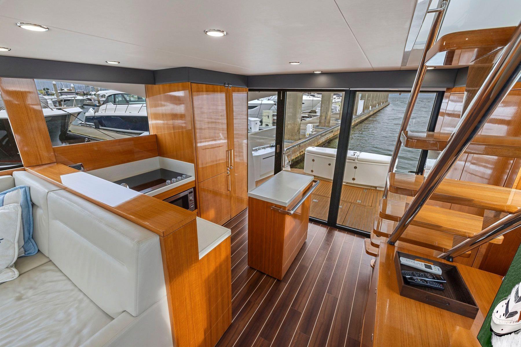 Luxurious interior of 2014 Maritimo M50 yacht with wooden finishes and modern design.