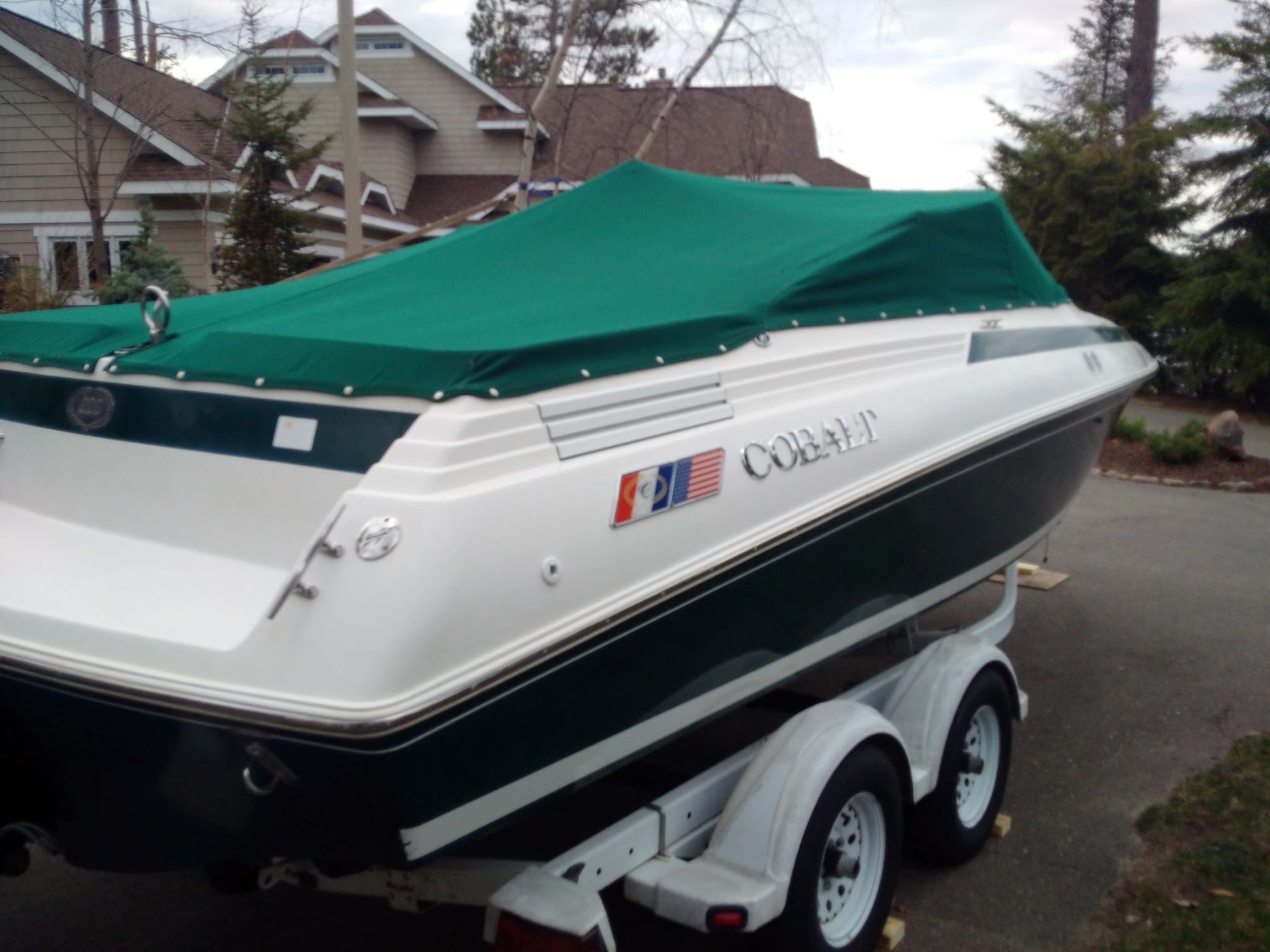1995 Cobalt 222 with green cover on a trailer.