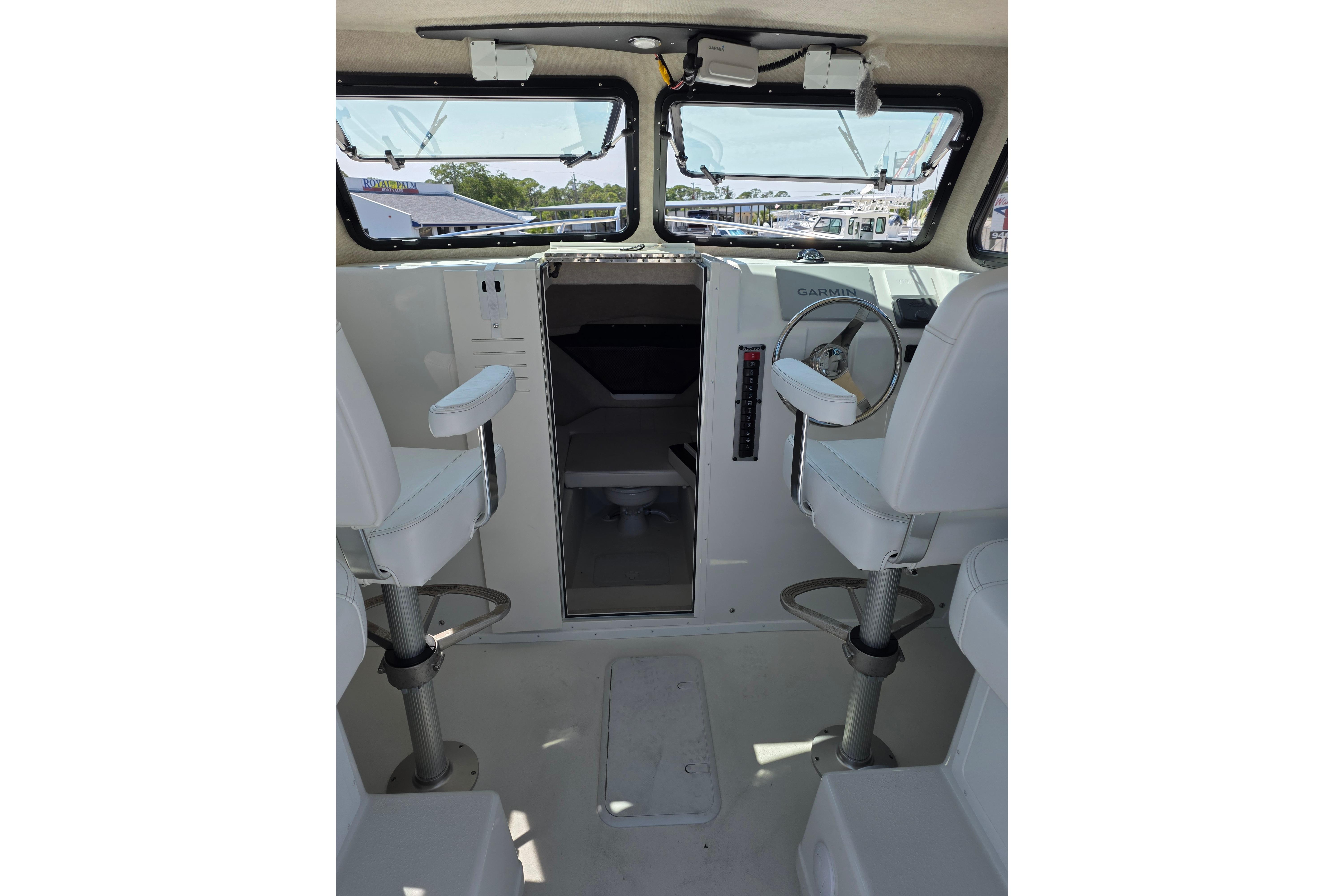 Interior of 2026 Parker 287 Explorer boat with helm and seating.