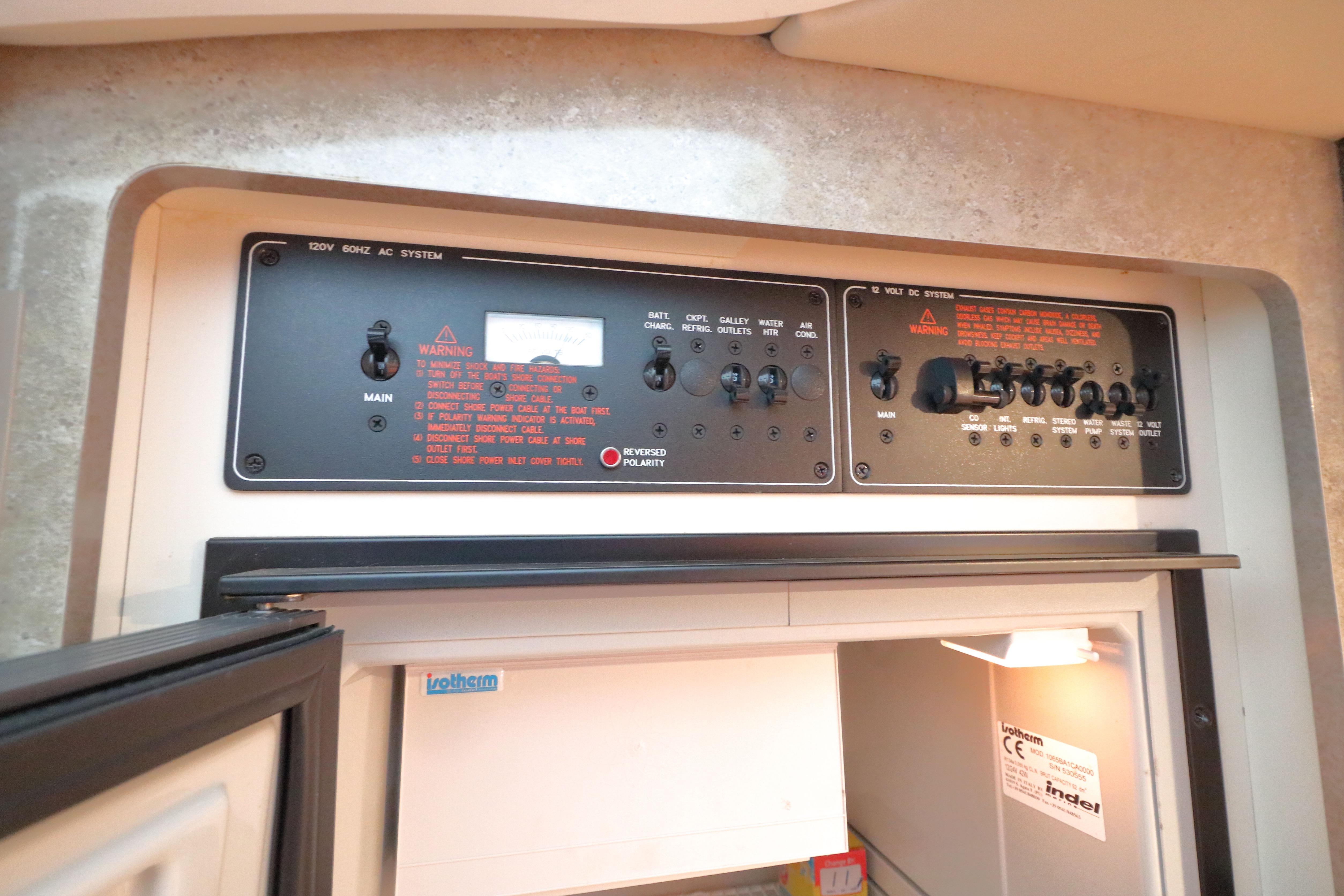 Control panel of a 2006 Formula 330 Sun Sport boat, featuring AC and DC systems.