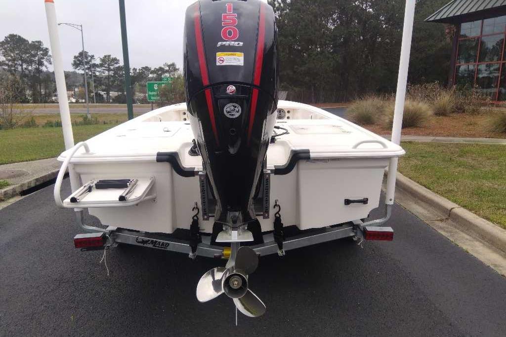 2026 Mako 18 Pro Skiff with 150 HP engine, parked on a trailer.