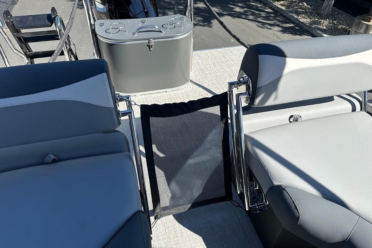 2026 Tahoe Pontoon LTZ Quad Lounger Shift 23 interior with gray seating and deck view.