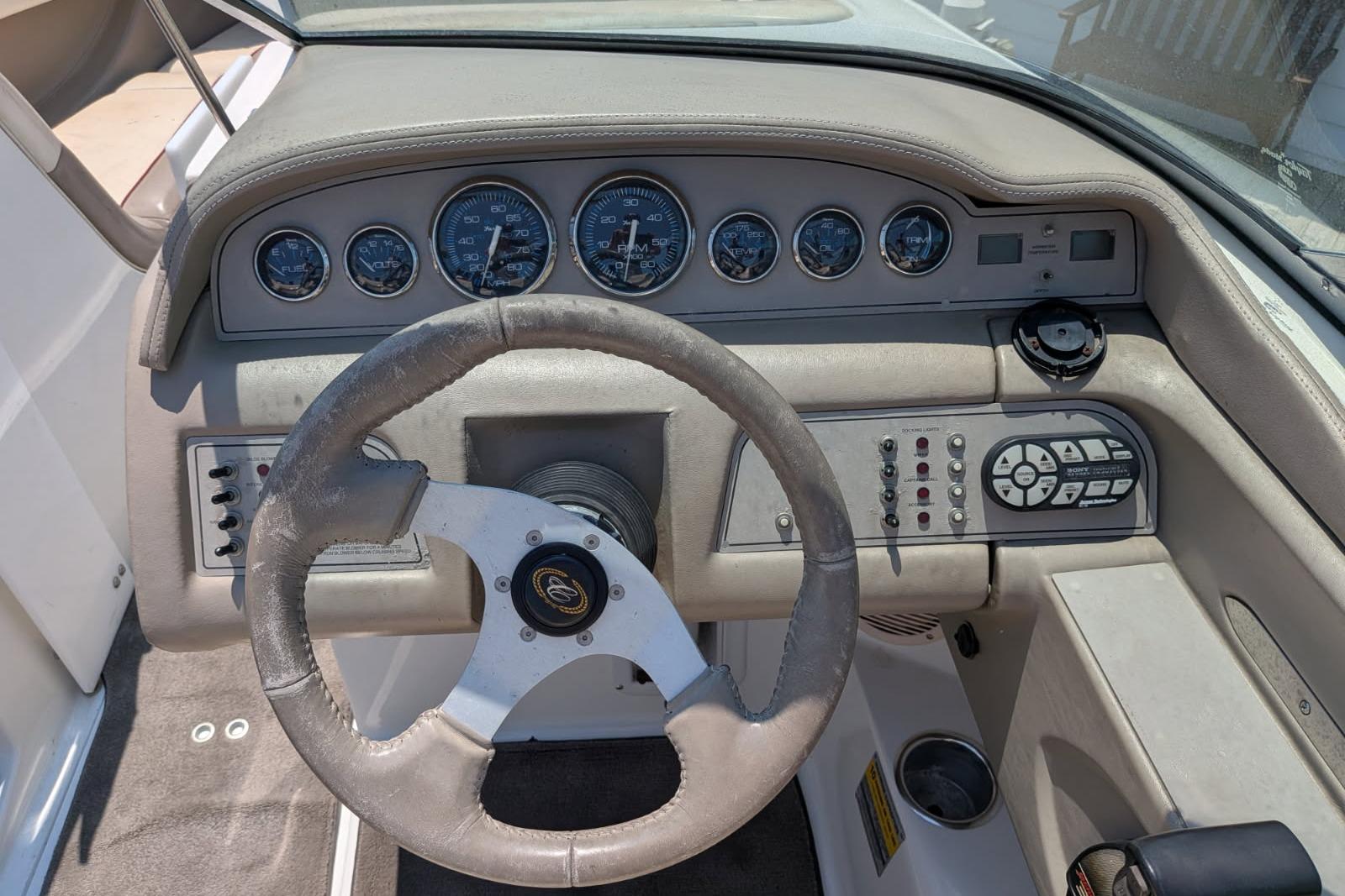 2020 Cobalt 206 boat dashboard with steering wheel and instrument panel.