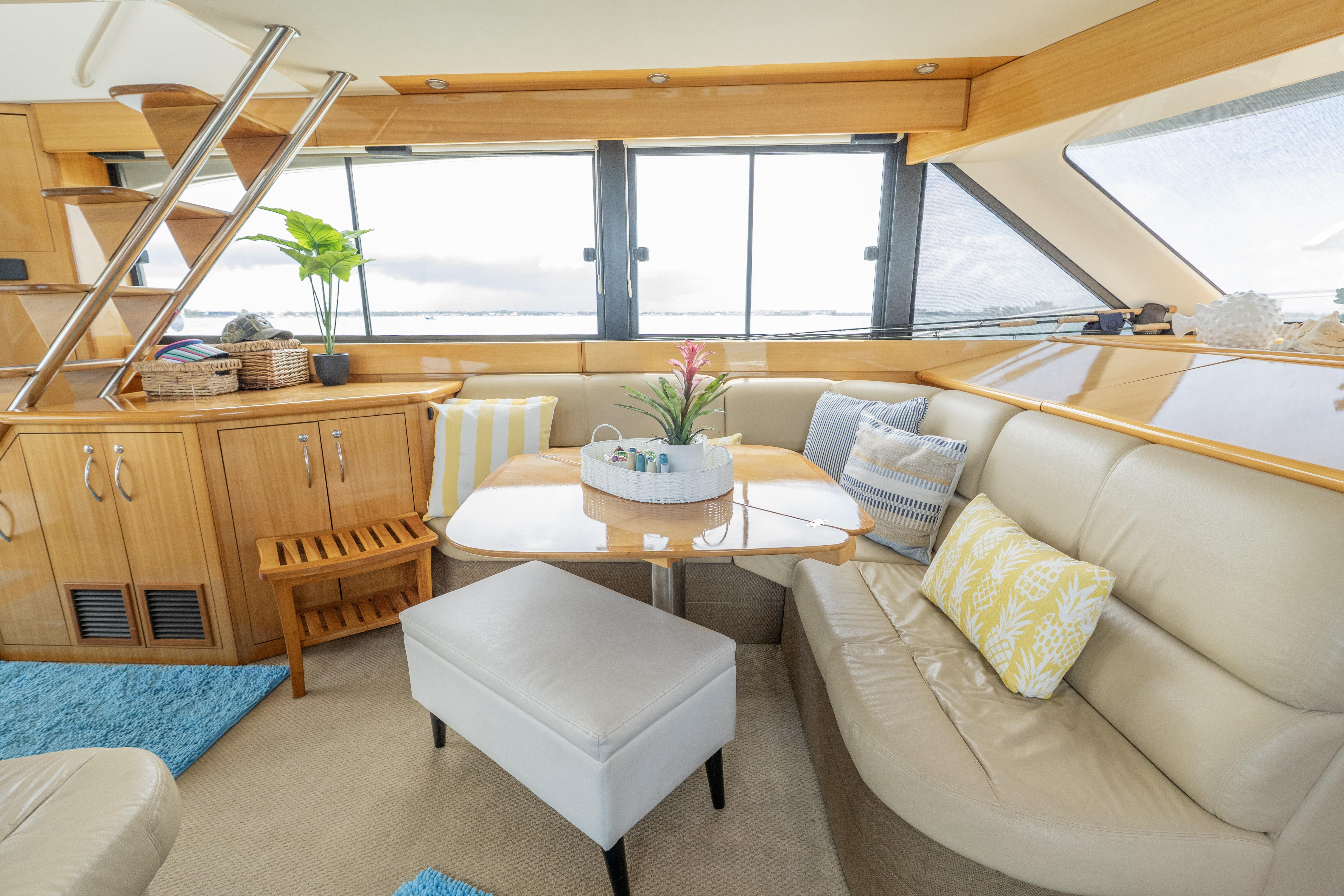 Luxurious interior of a 2008 Maritimo 52 yacht with cozy seating and elegant decor.