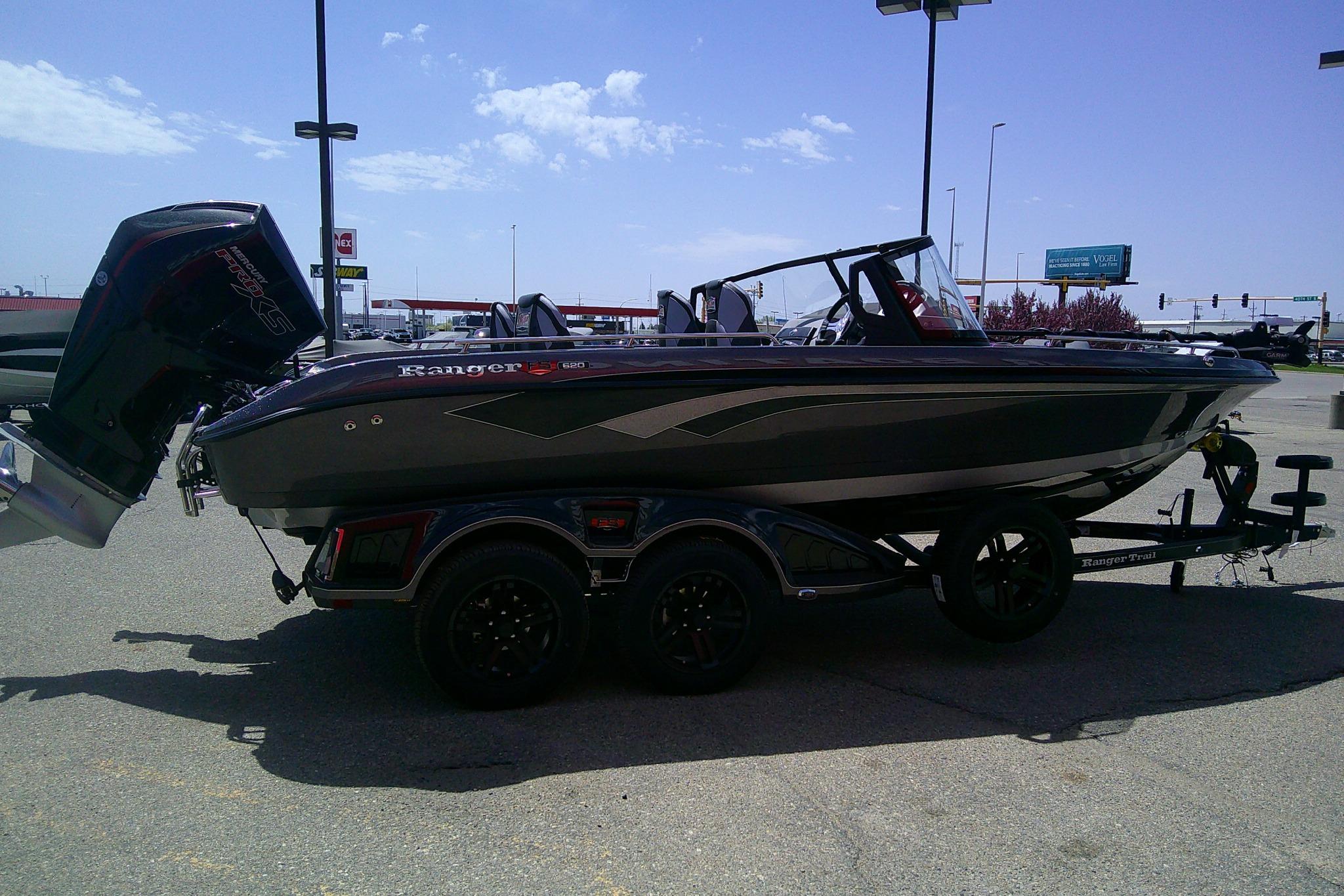2026 Ranger 620FS Cup-Equipped boat on trailer in parking lot.