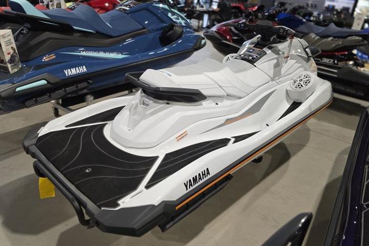 2026 Yamaha WaveRunner GP HO jet ski in showroom, sleek white design.