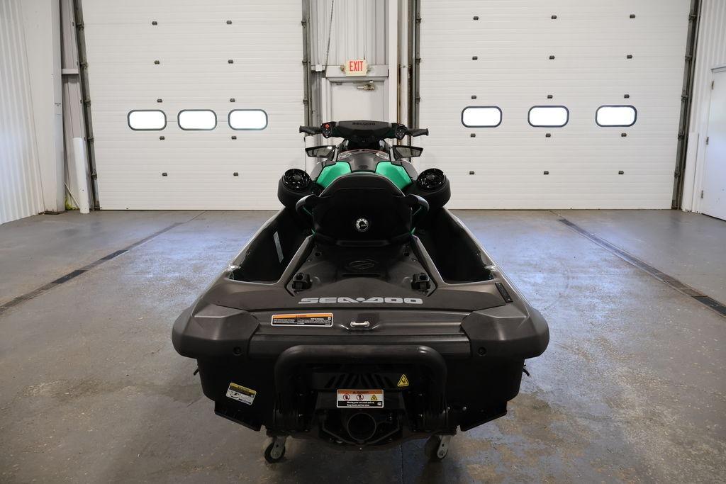 2026 Sea-Doo GTI SE 130 jet ski in a garage, rear view.