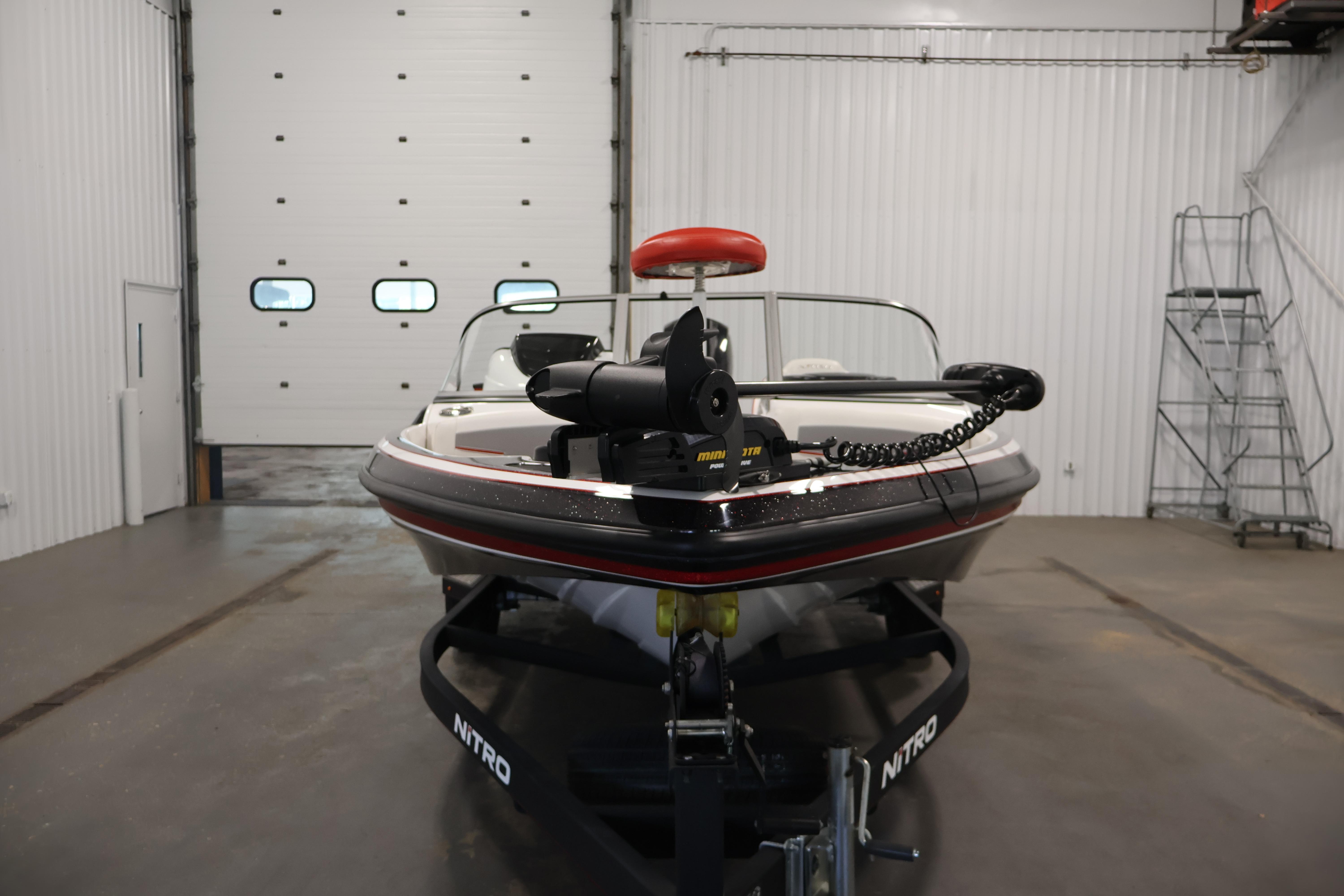 2019 Nitro Z19 Sport boat in a garage, featuring a Minn Kota trolling motor.