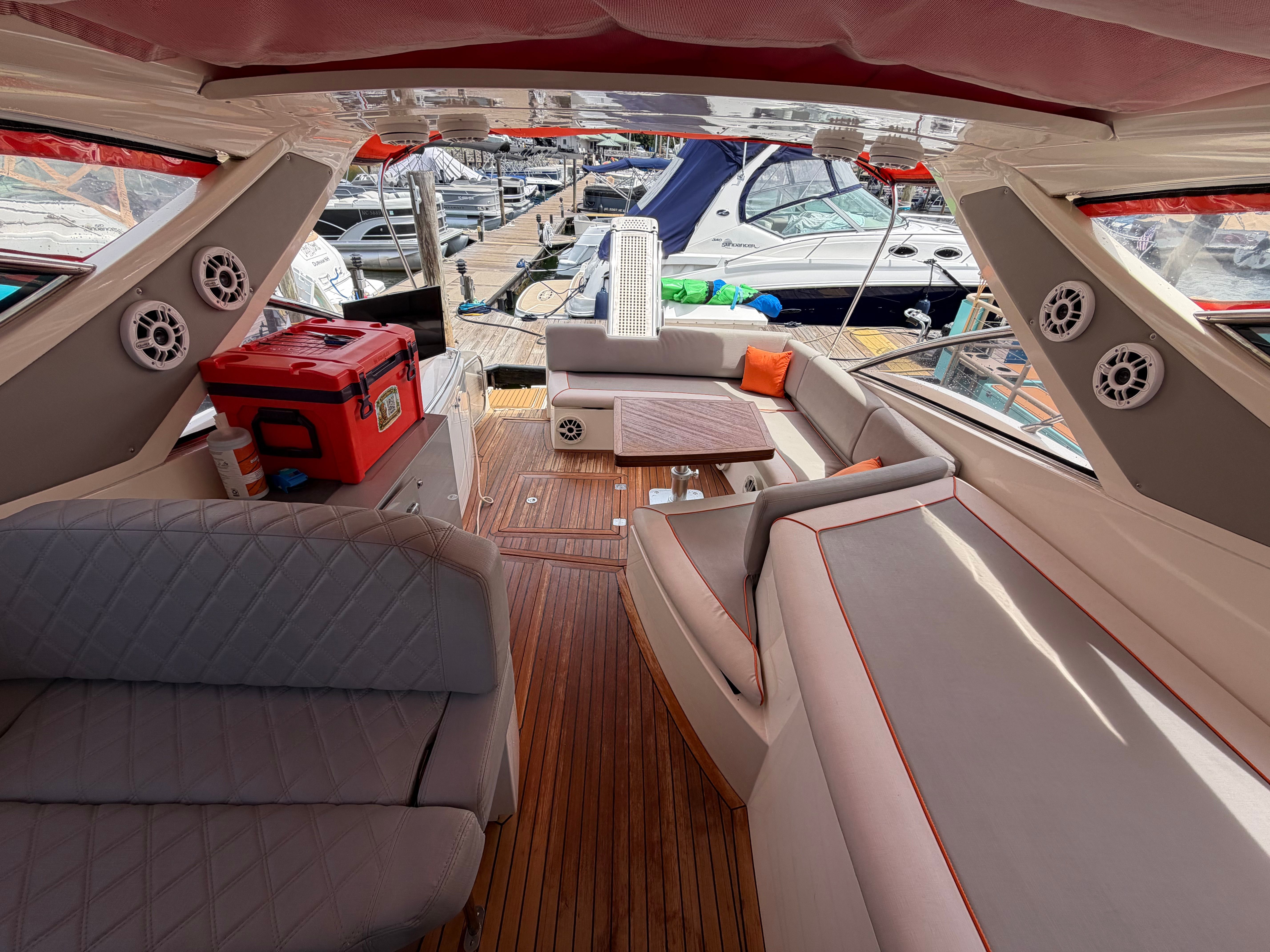 Interior of a 2011 Azimut Atlantis 40 with elegant seating and wooden flooring.