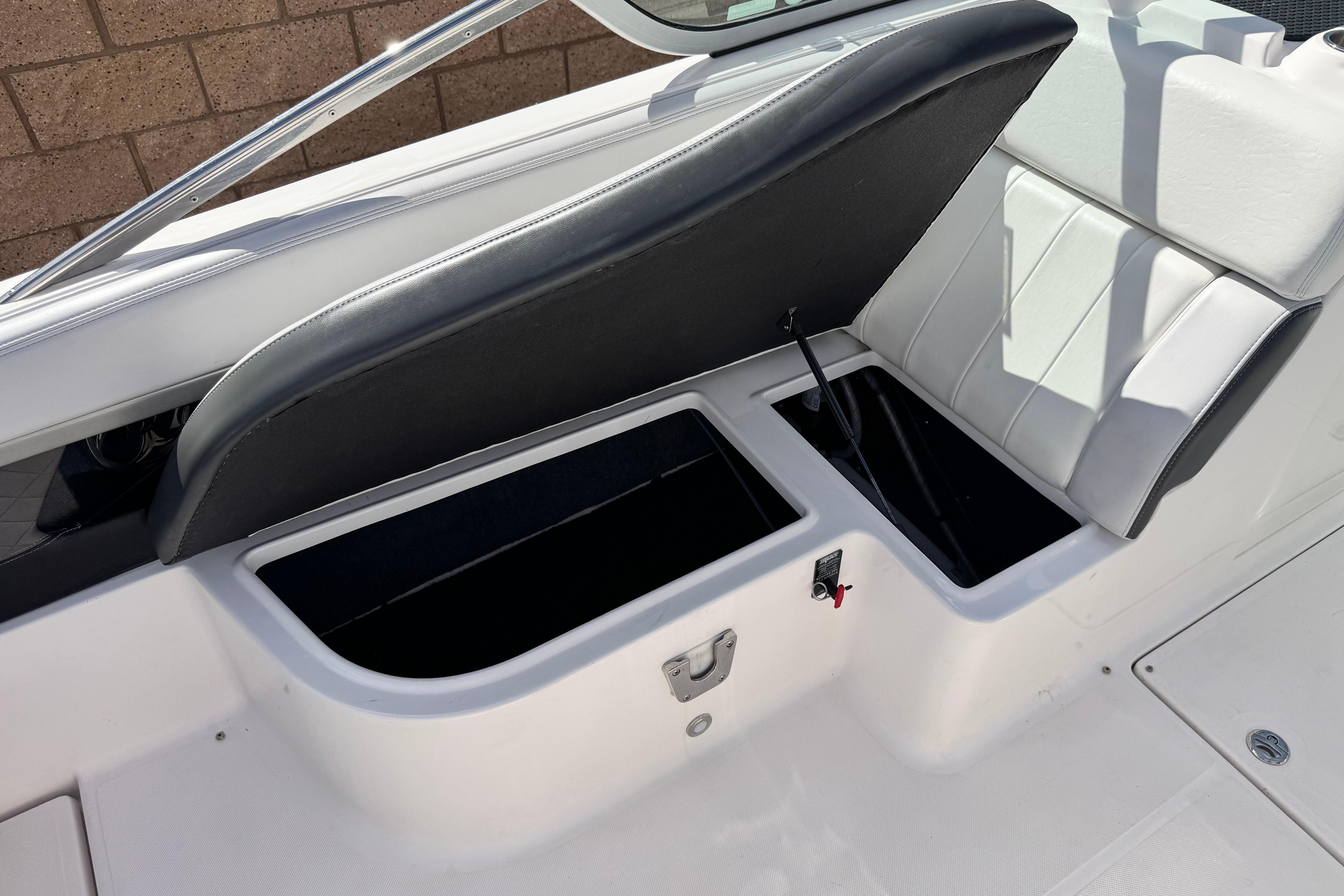 2014 Regal 27 FasDeck boat interior with open storage compartments.