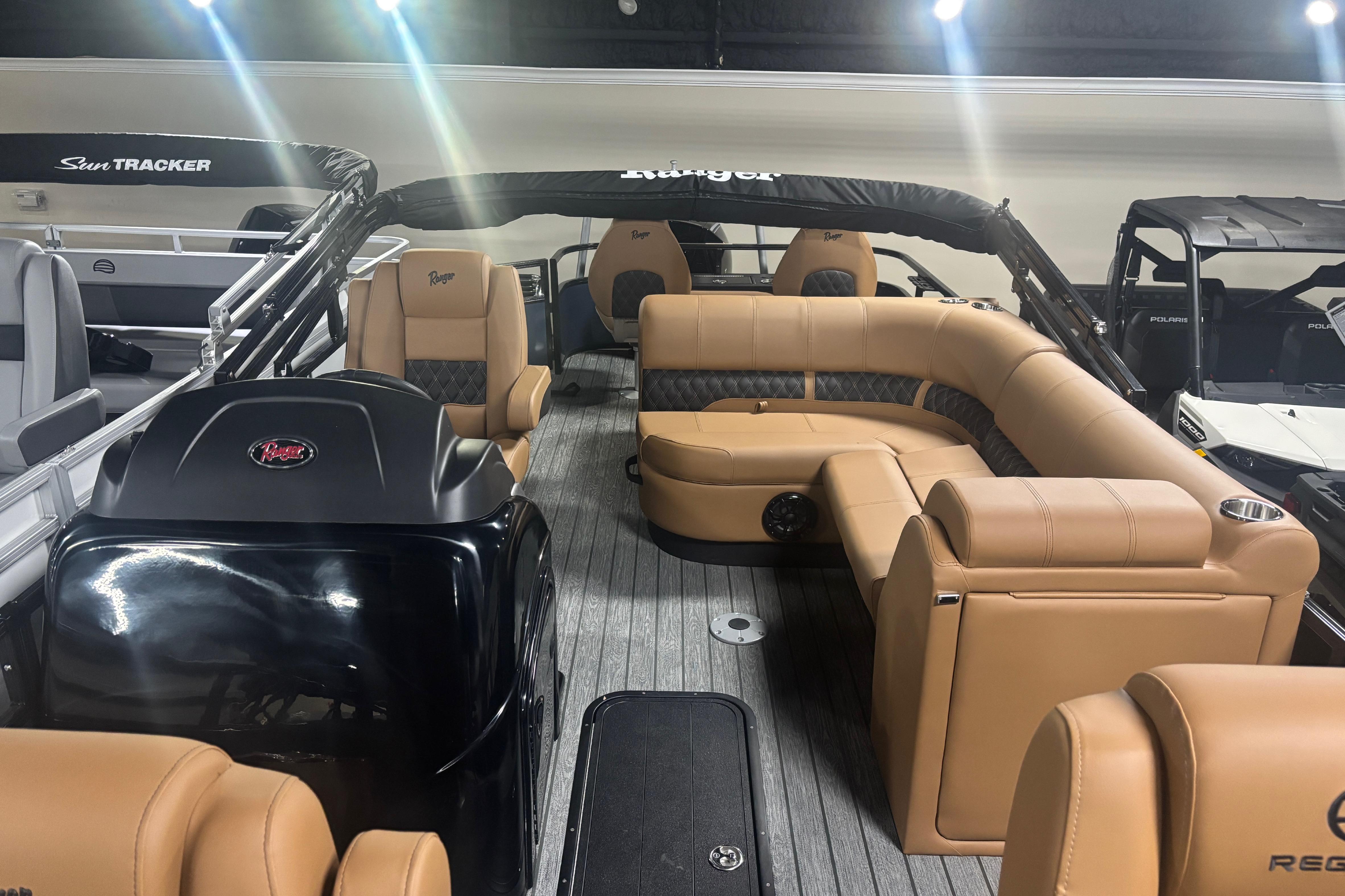 2026 Ranger 223F boat interior with tan leather seating and modern design.