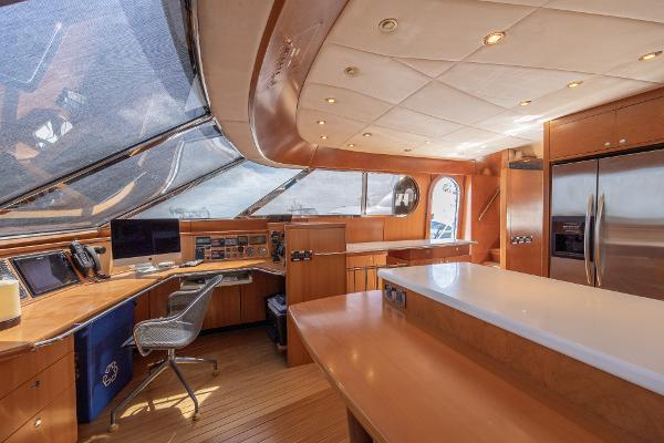 Luxurious interior of 2001 Grand Harbour 76 yacht with modern kitchen and navigation area.