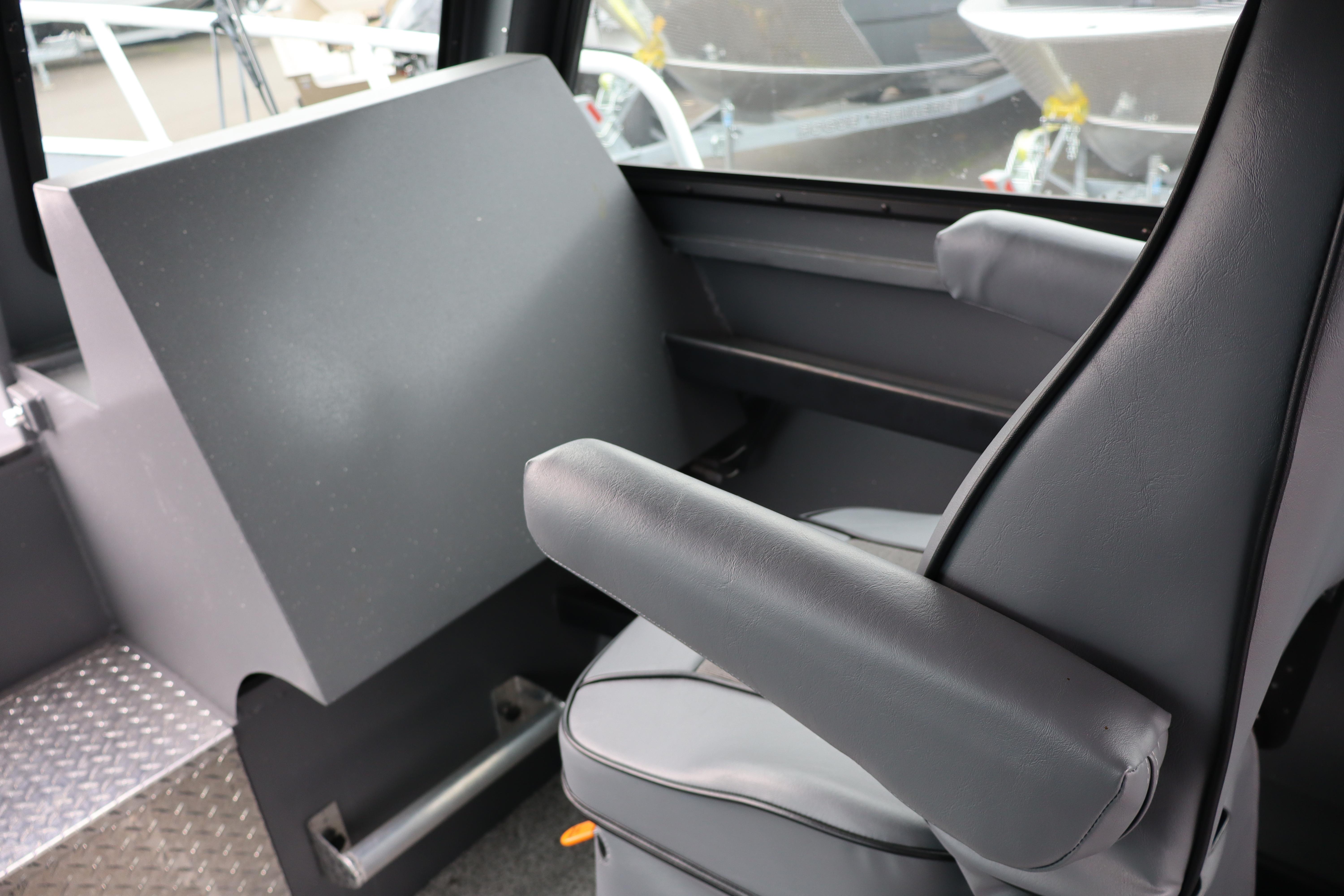 Interior of 2026 Alumaweld Horizon 24 boat, featuring a comfortable captain's chair.