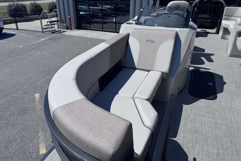2027 Manitou Aurora 23 RF SHP pontoon boat with spacious seating and modern design.