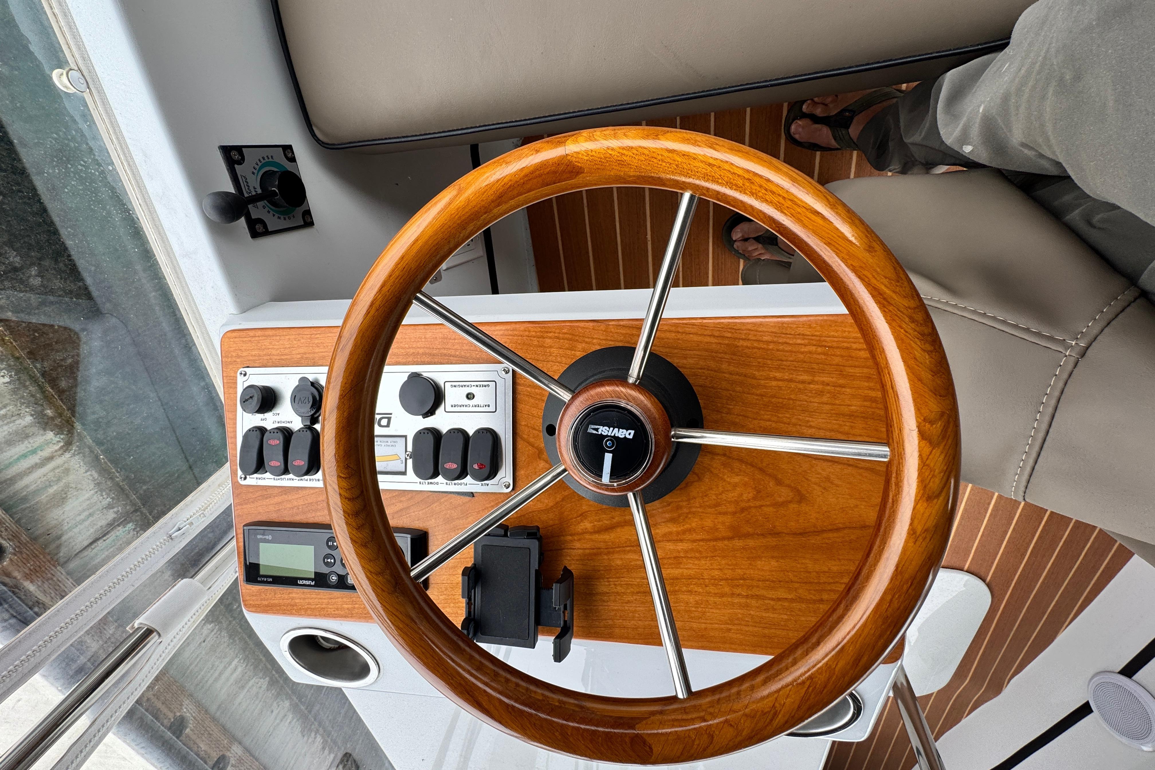 Steering wheel and controls of a 2023 Duffy Bay Cruiser boat.