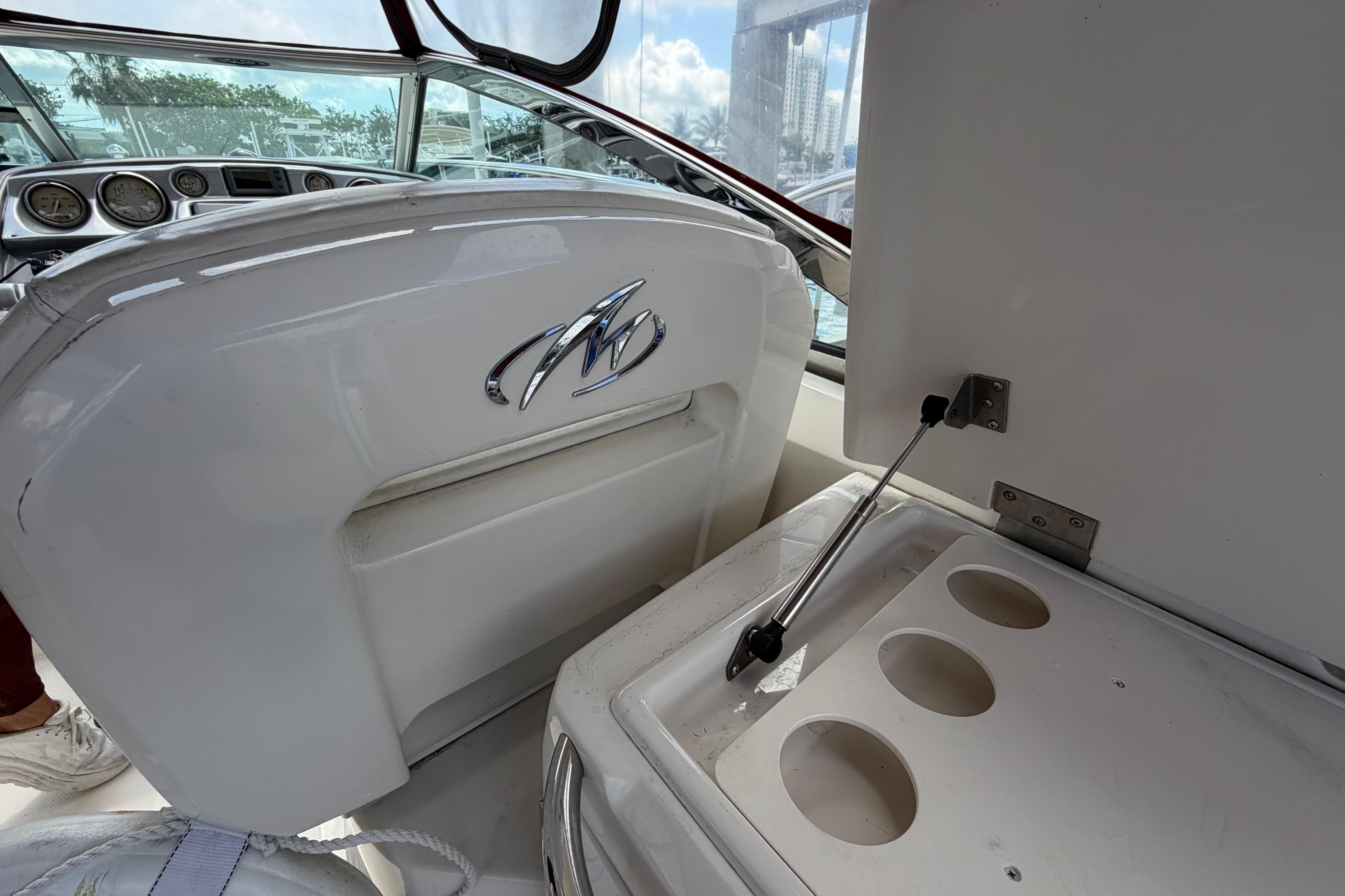 2007 Monterey 350 Sport Yacht interior with dashboard and cup holders.