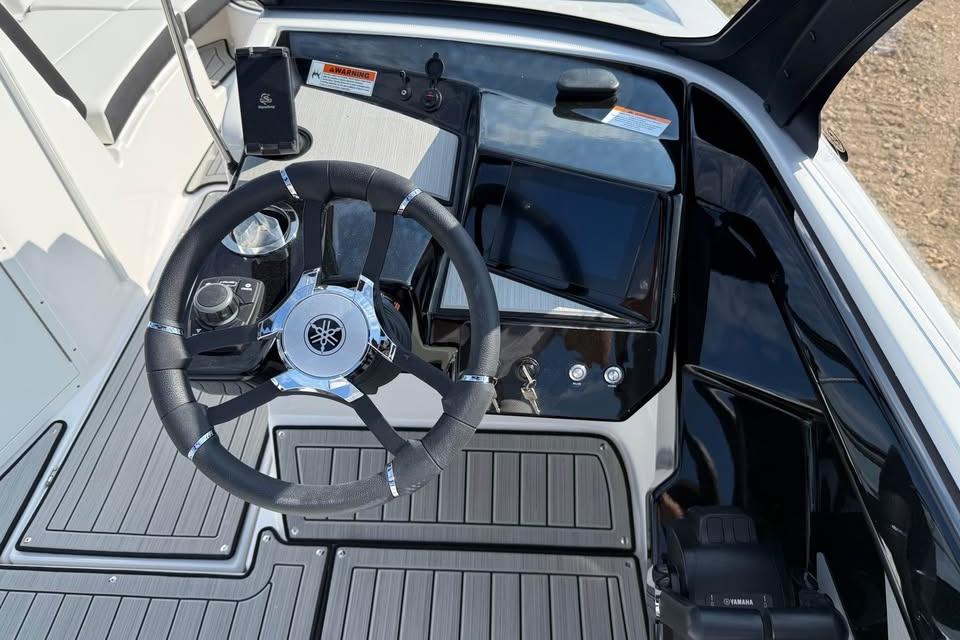 2026 Yamaha Boats 222S dashboard with steering wheel and control panel.