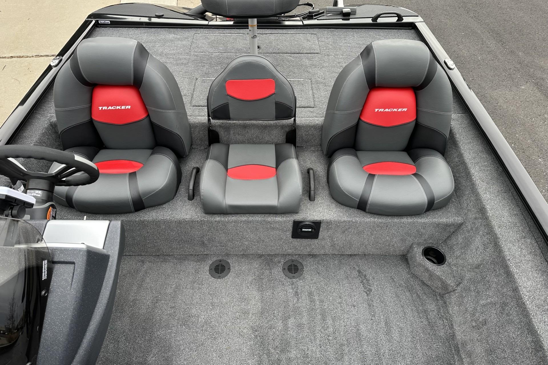 2025 Tracker Savage 215 boat interior with three gray and red cushioned seats.