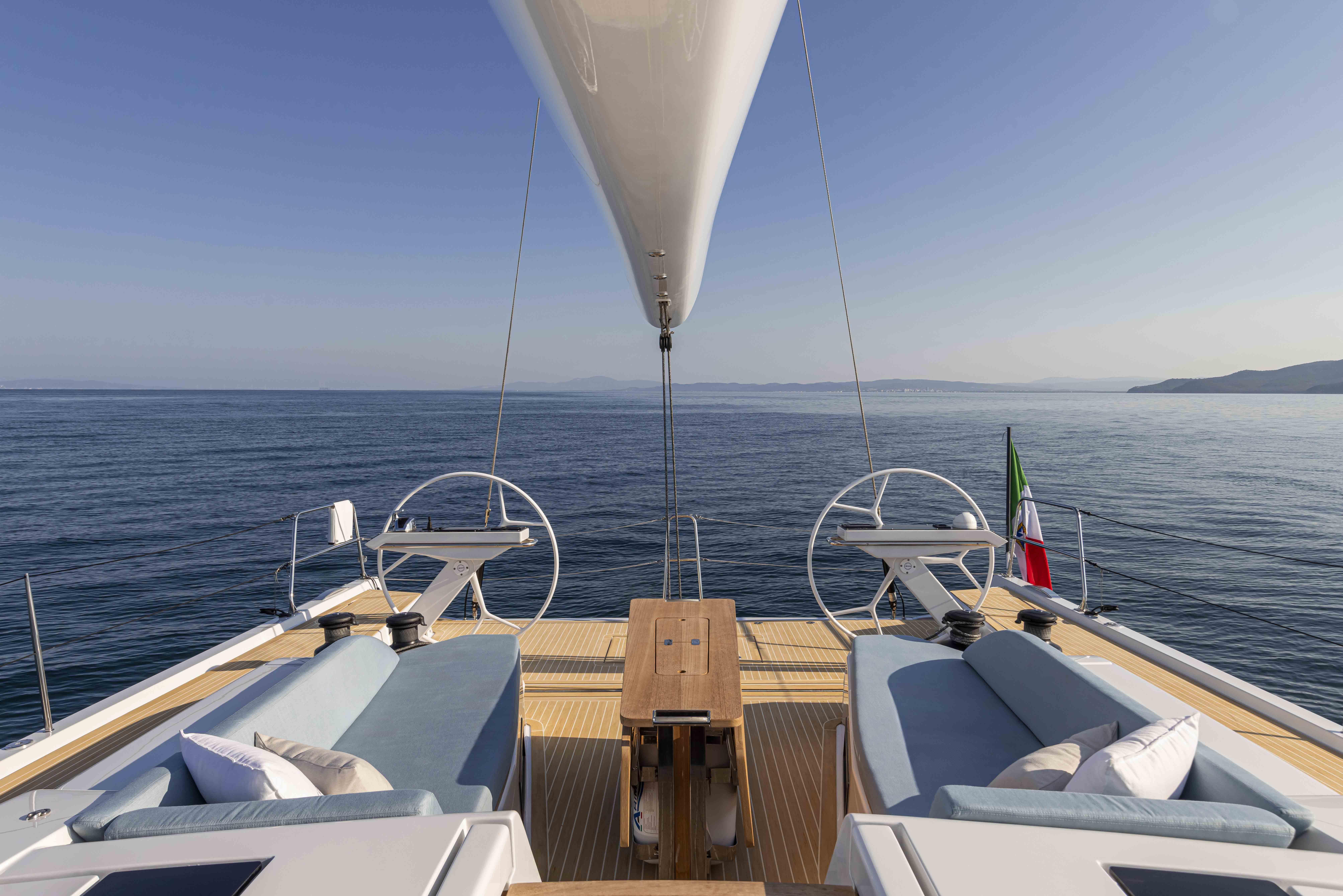 Luxurious Grand Soleil 52 Performance yacht deck, 2025 model, with ocean view and elegant seating.