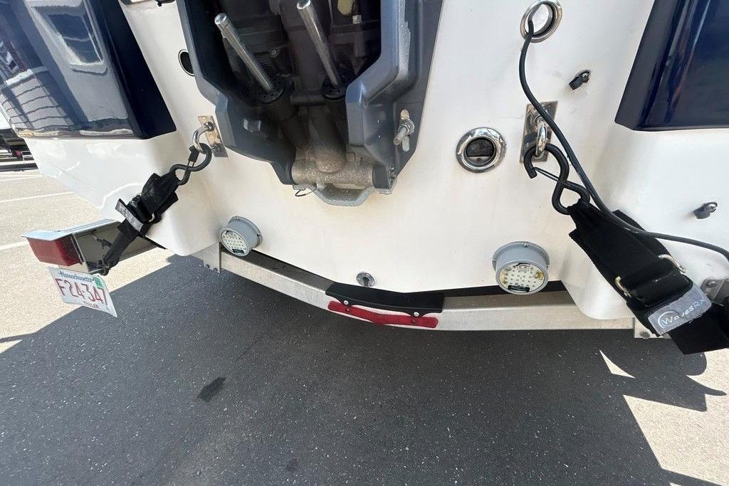 Rear view of a 2017 Robalo R200ES boat with trailer attachments.