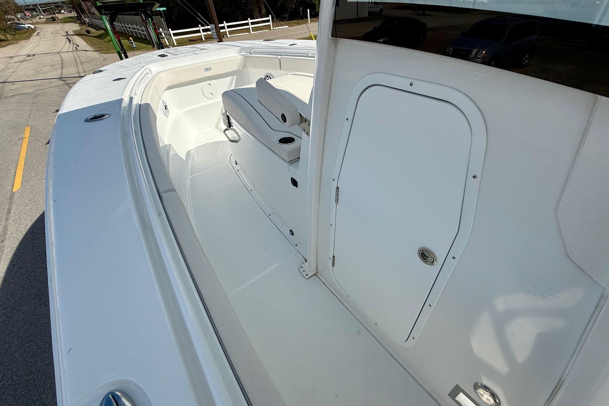 2026 Sea Hunt Ultra 285 Coffin Box boat interior with seating and storage.