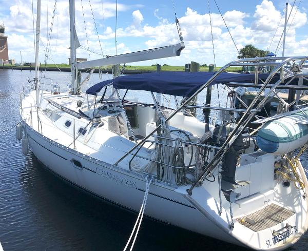 Jeanneau 45.2 sailboat, 2001 model, docked in a marina under a clear blue sky.