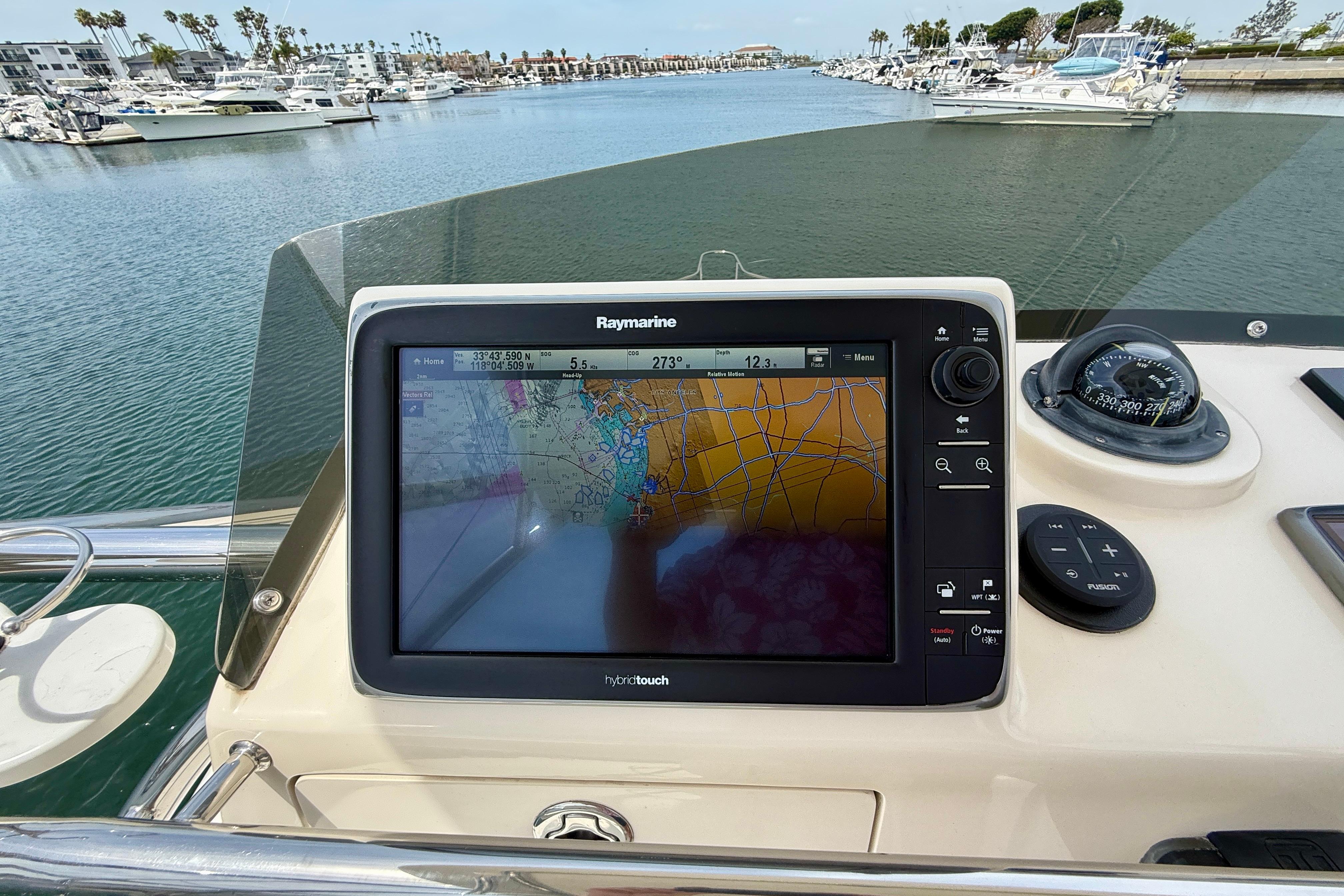 Navigation system on 2012 Pursuit OS 345 Offshore boat, displaying nautical chart.