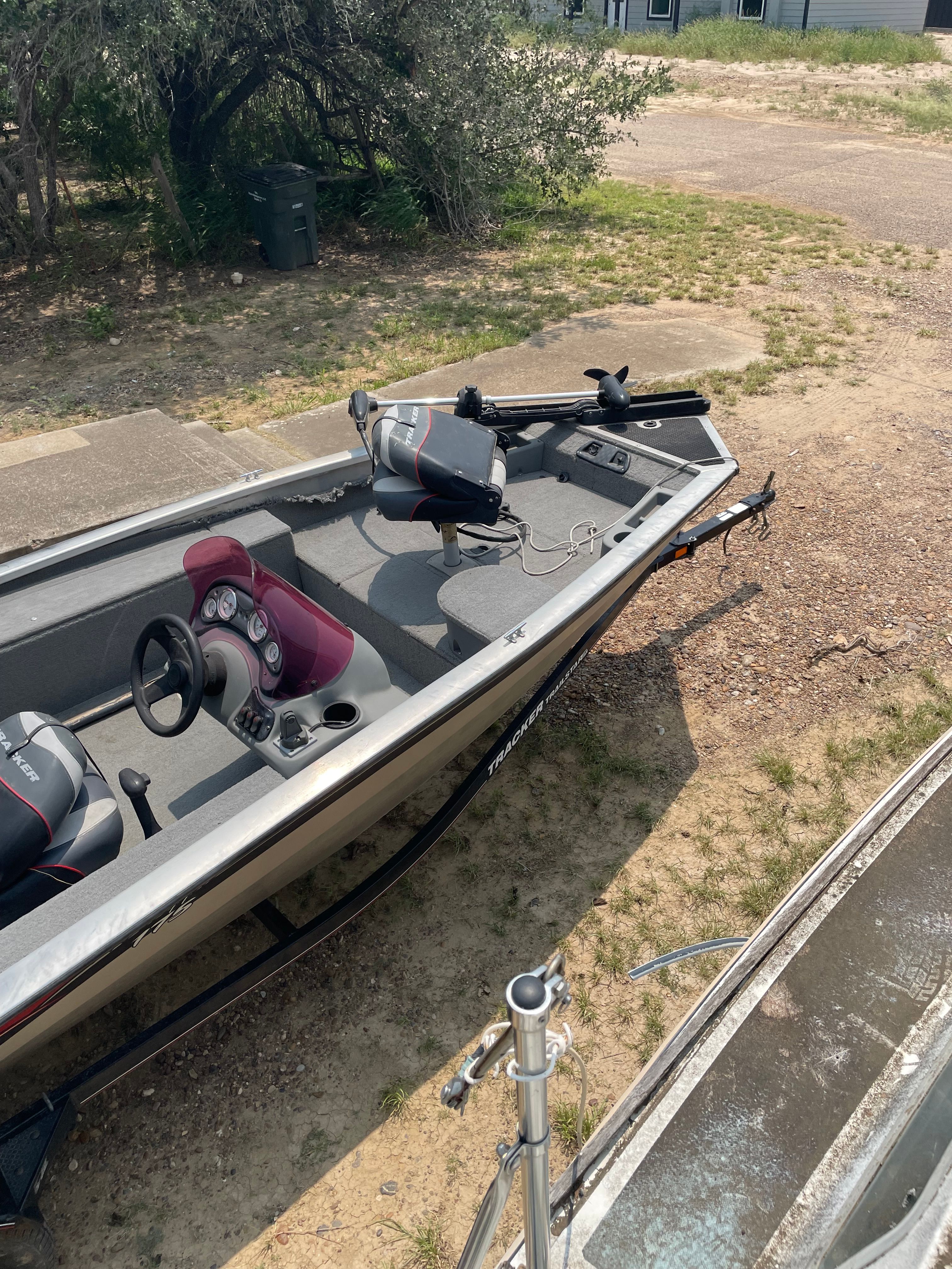 A 2009 Tracker Pro Crappie 175 boat is on dry land.