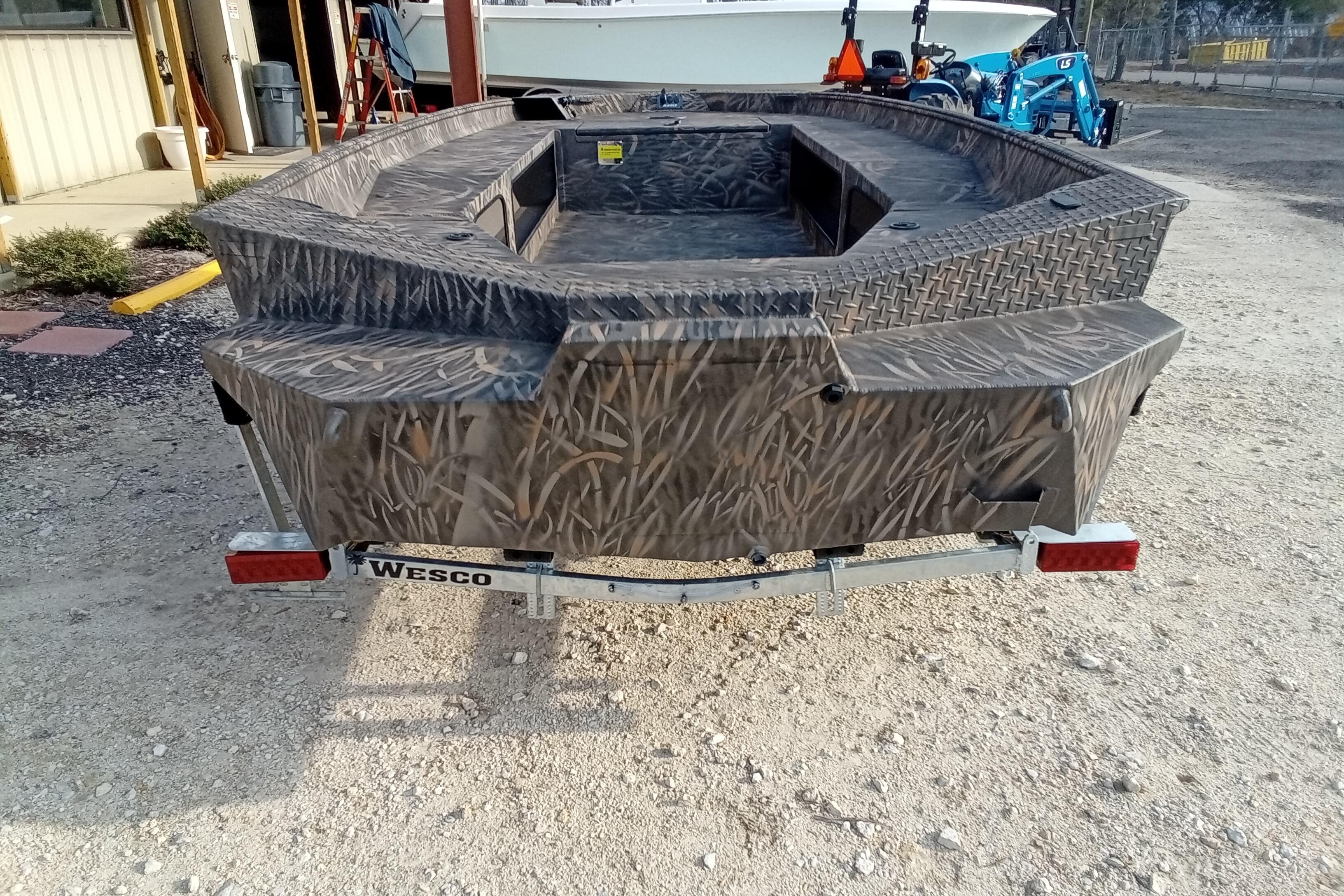 2026 Alweld 1756 Invader boat on Wesco trailer, featuring camouflage design.